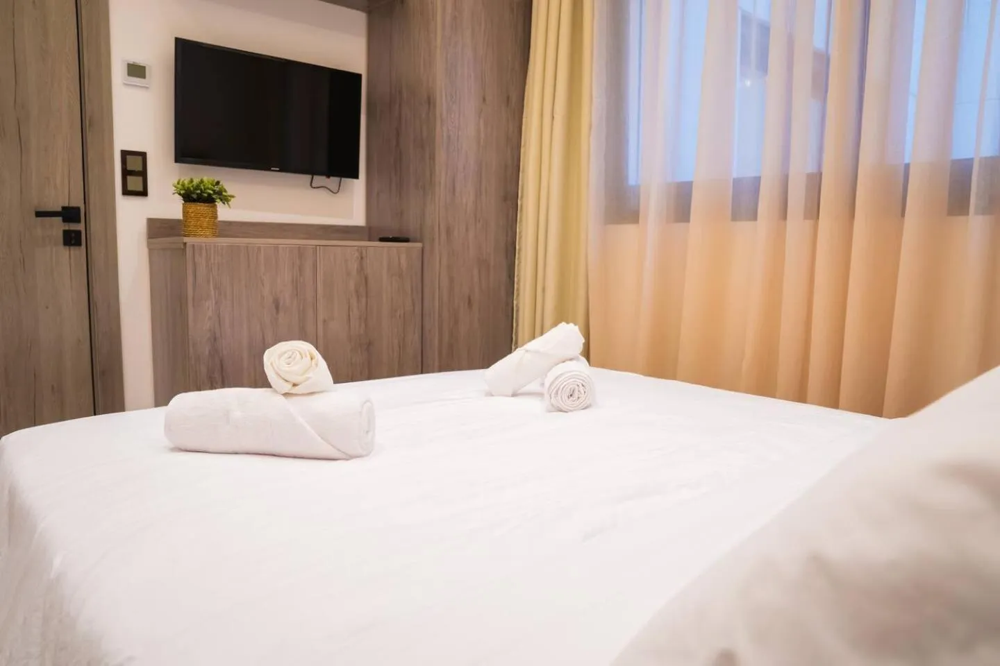 Bed in Amelia Appart-Hotel