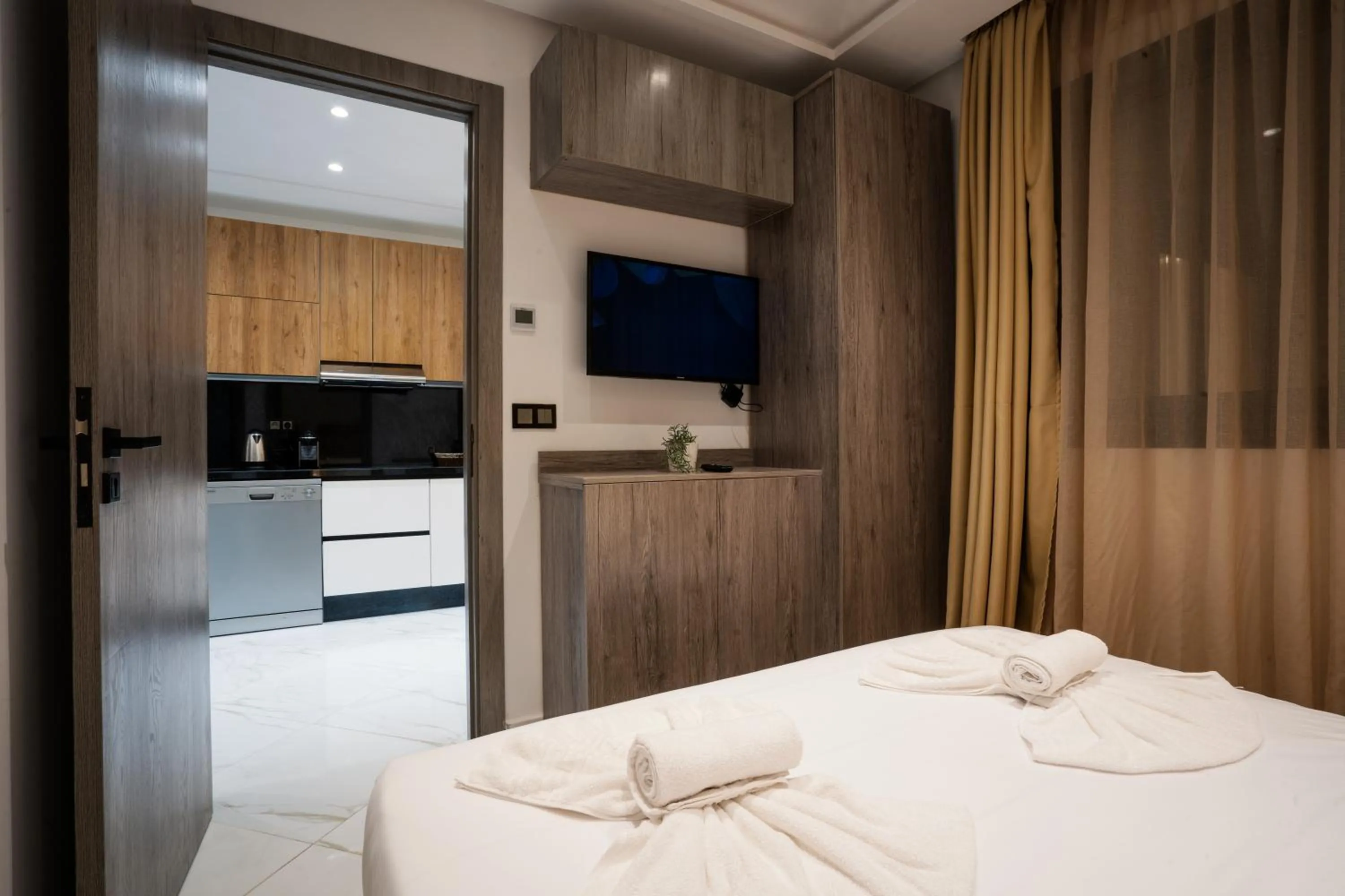 Bed in Amelia Appart-Hotel