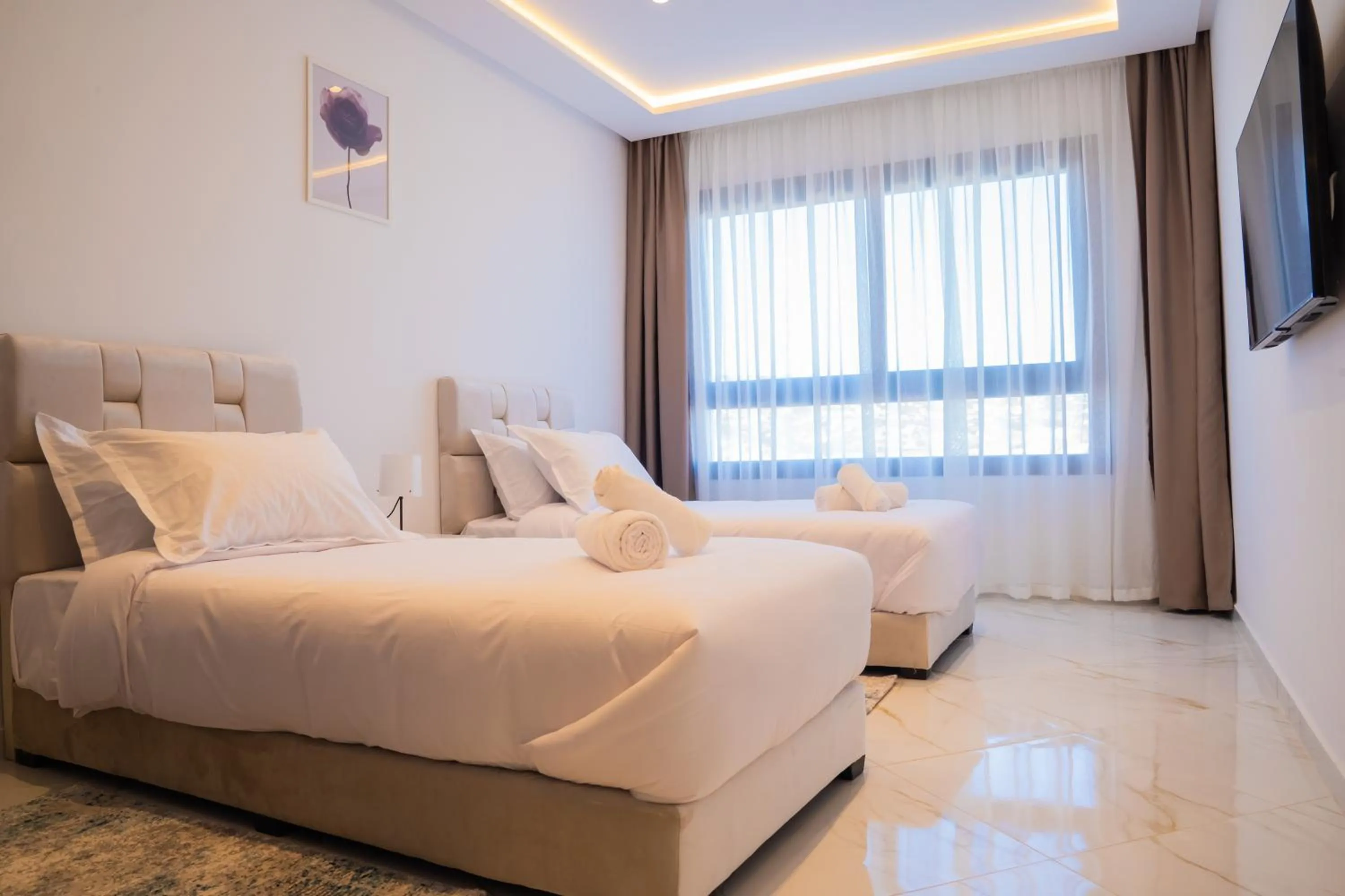 Bed in Amelia Appart-Hotel