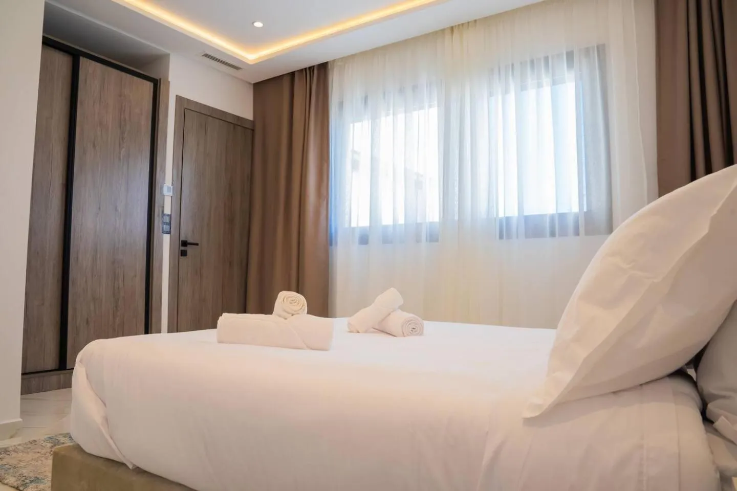 Bed in Amelia Appart-Hotel