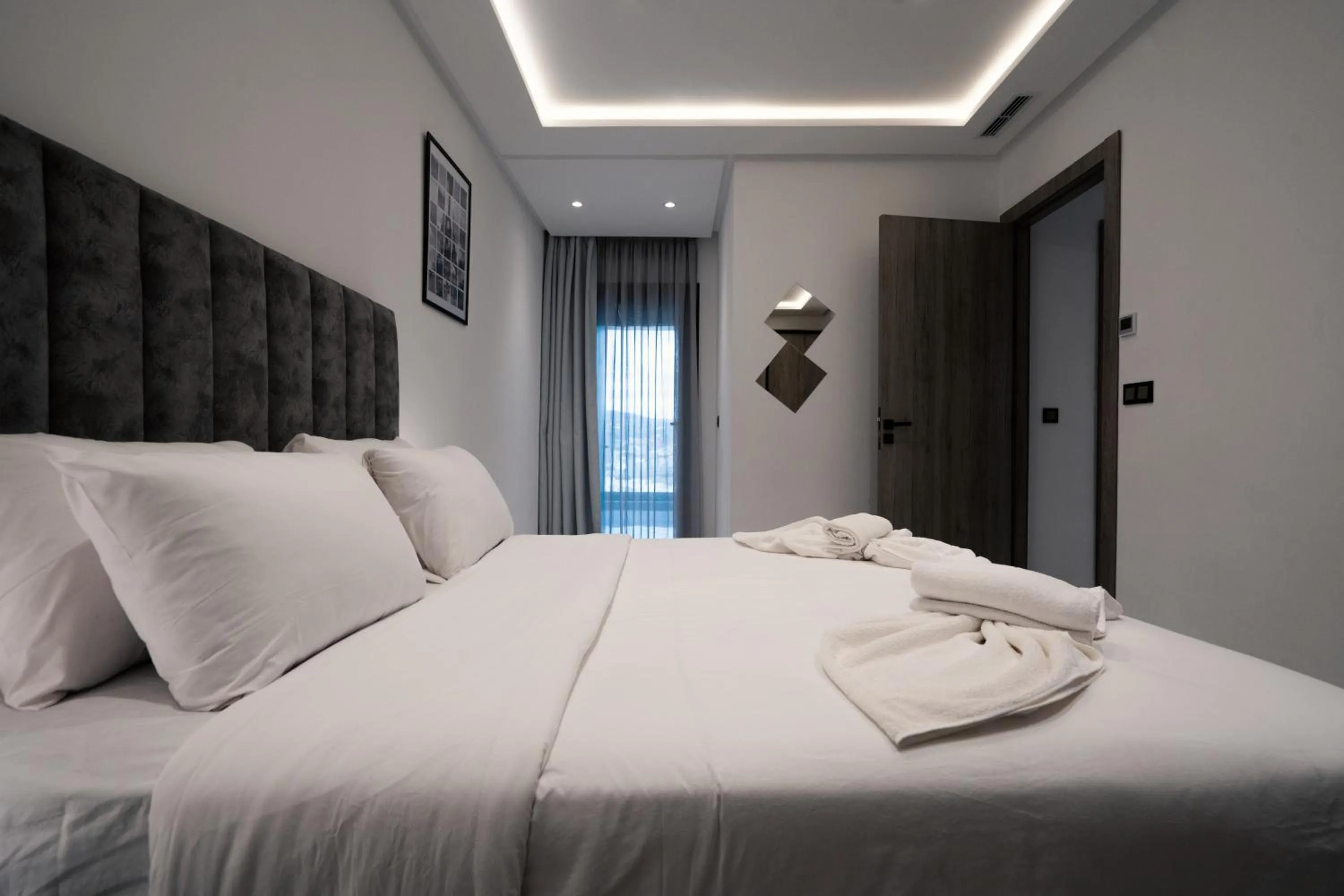 Bed in Amelia Appart-Hotel