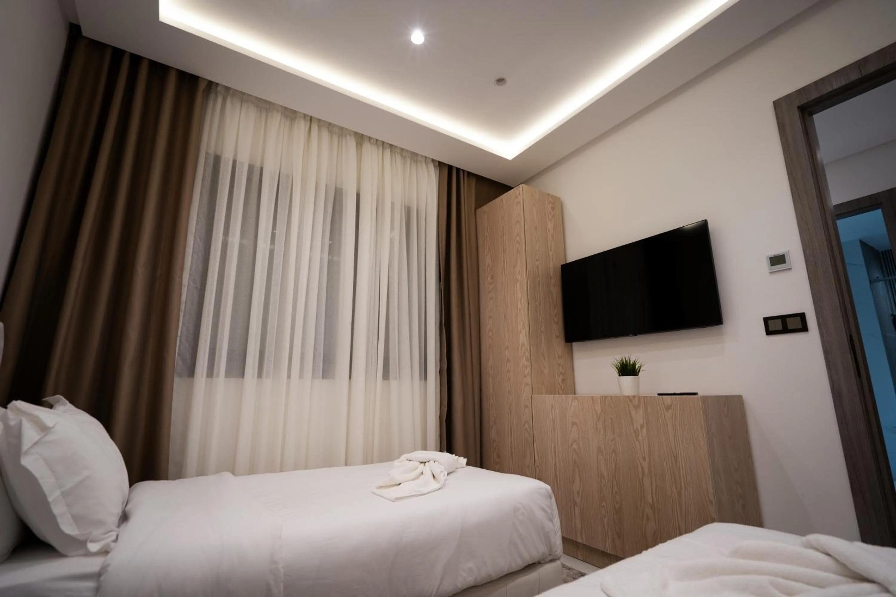 Bed in Living Appart-Hotel