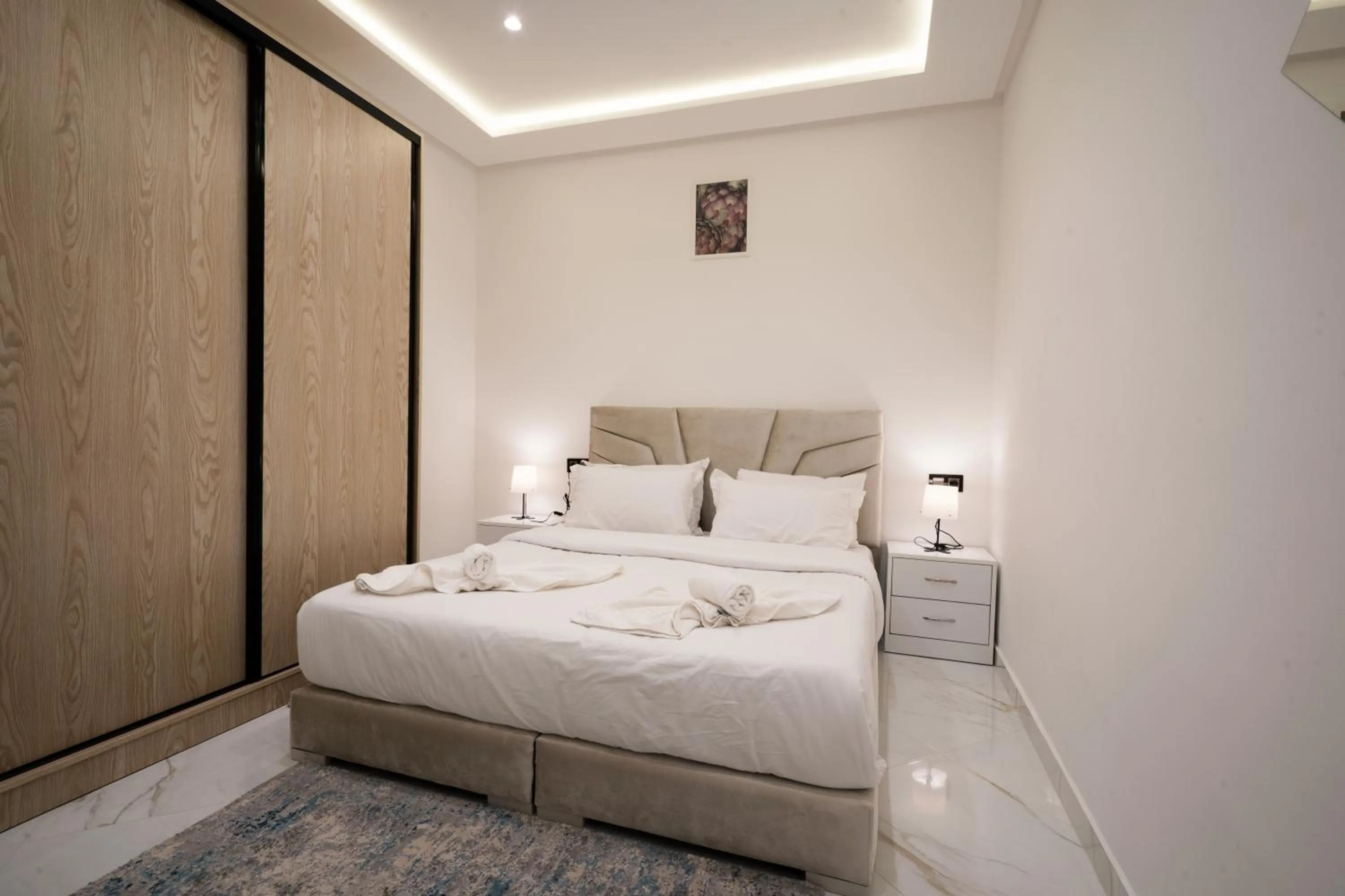 Bed in Living Appart-Hotel