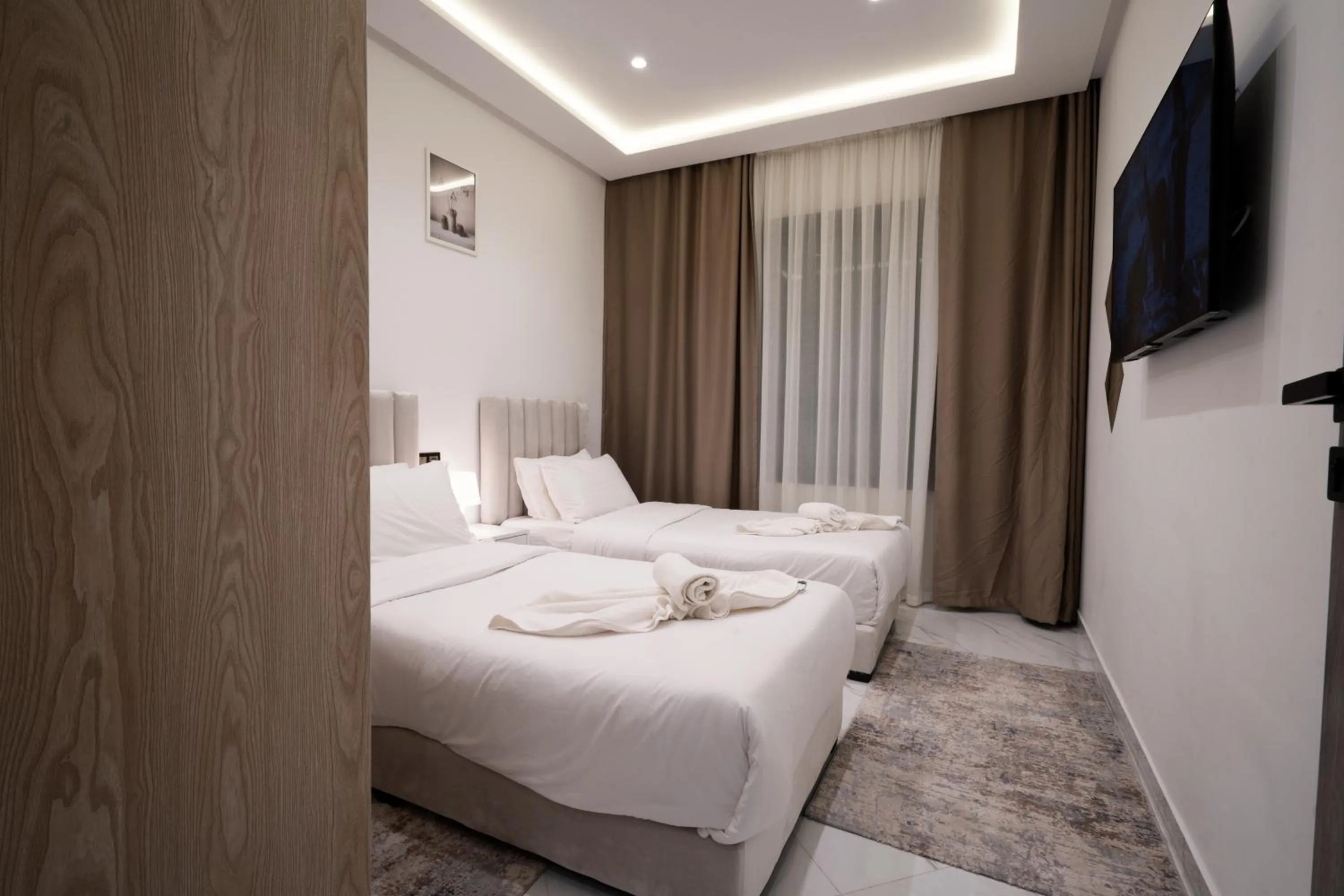 Bed in Living Appart-Hotel