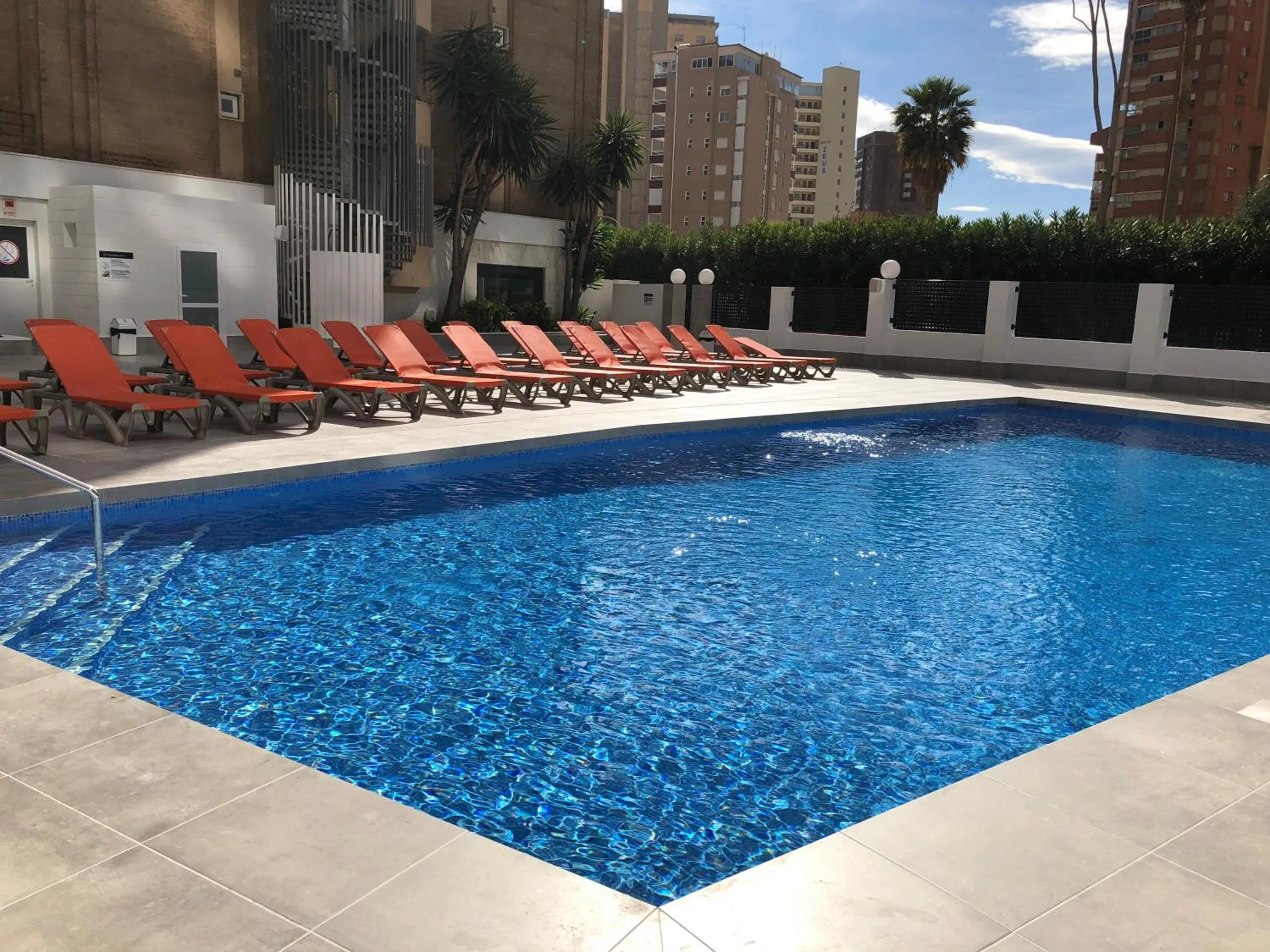 Swimming pool in Apartamentos Amalia By Mc