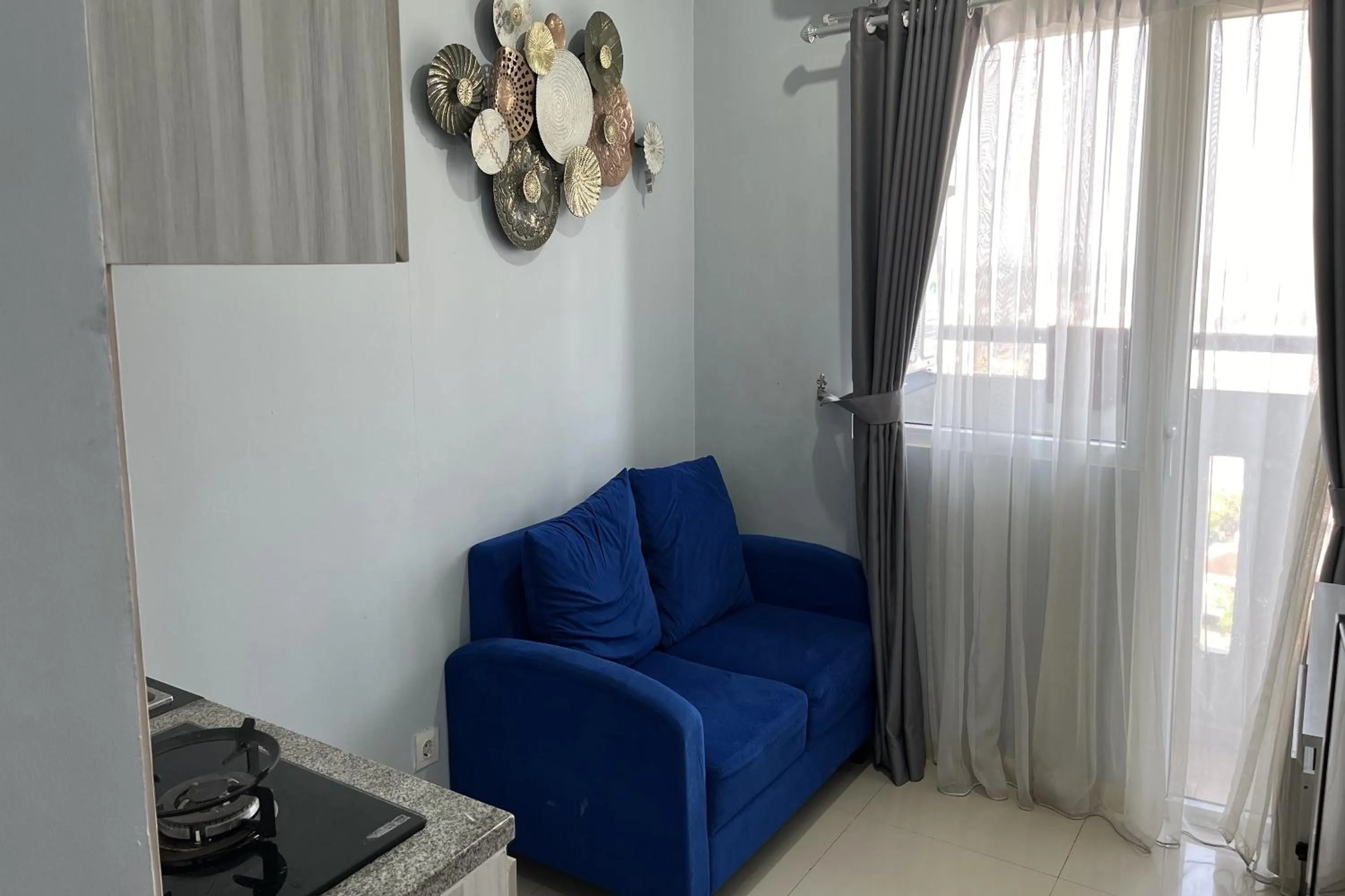 Living room in Green Pramuka by Uchi Property