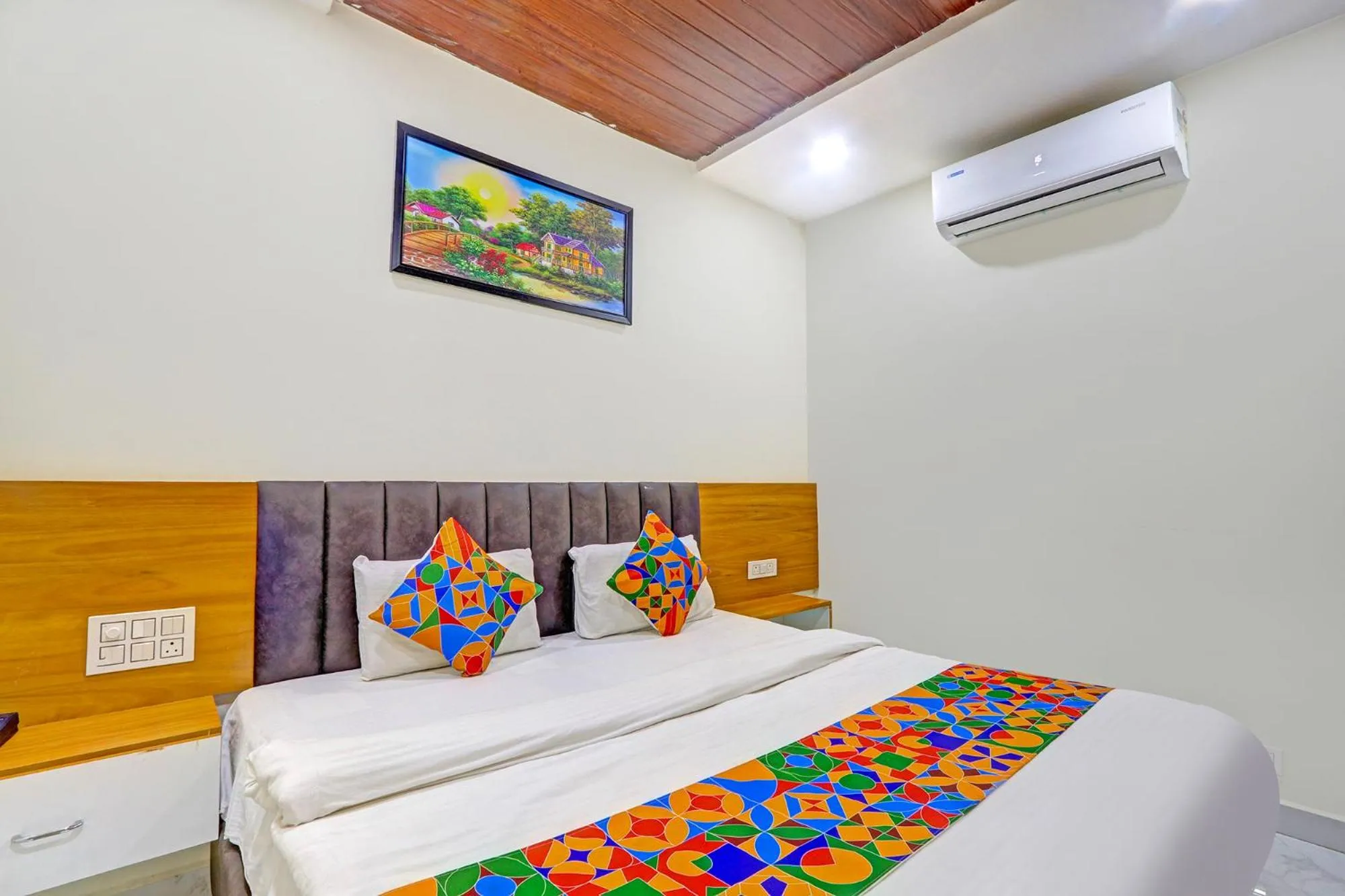 Bed in FabHotel Dharani Grand - Nr Mamata Medical College