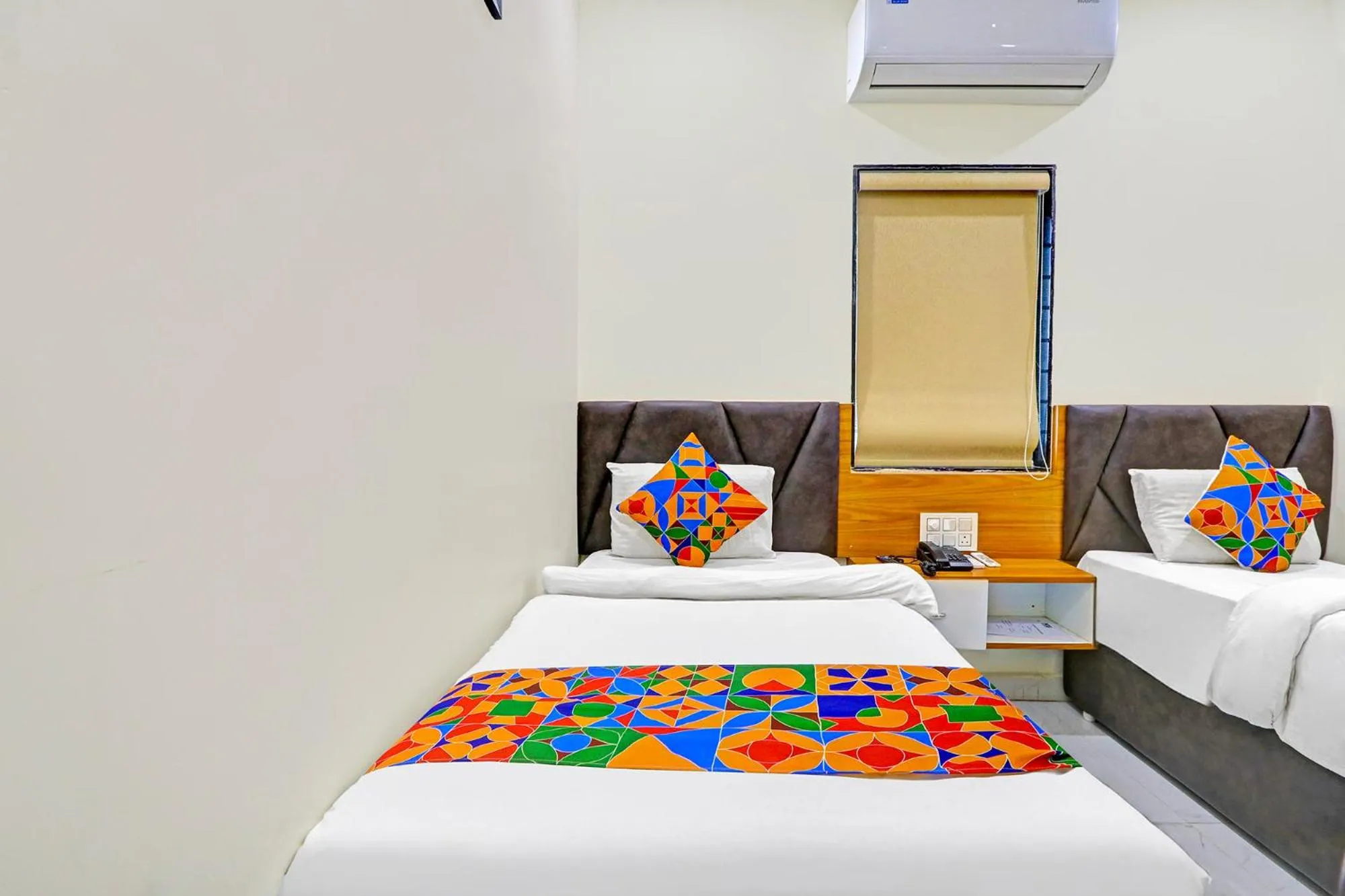 Bed in FabHotel Dharani Grand - Nr Mamata Medical College