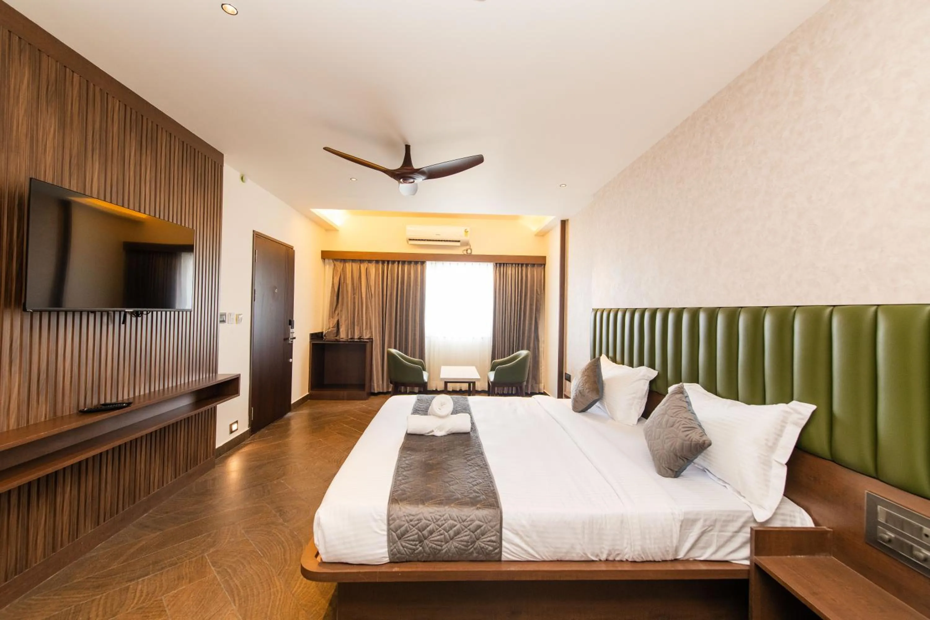 Bed in Hotel Mysore Radiance