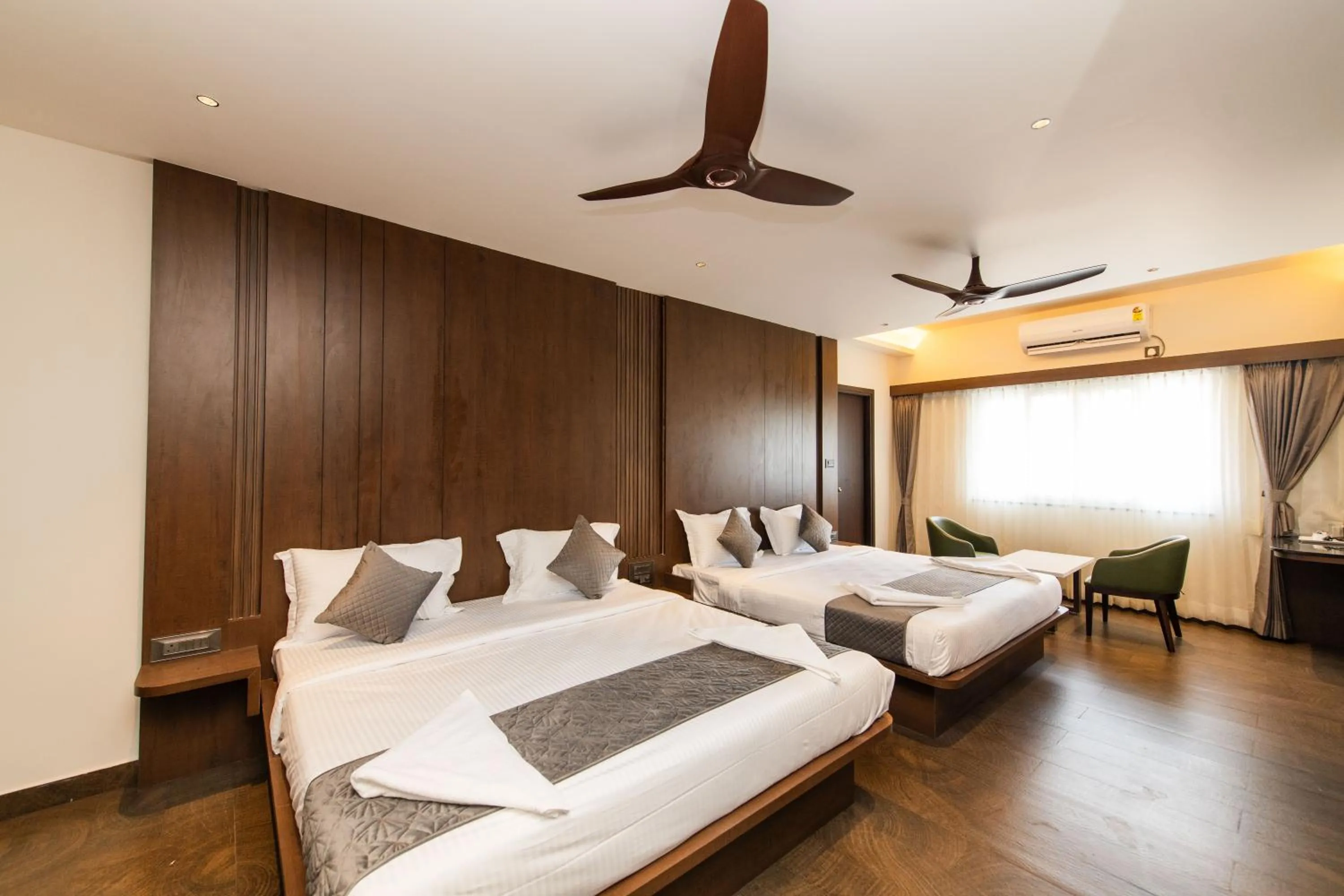 Bed in Hotel Mysore Radiance