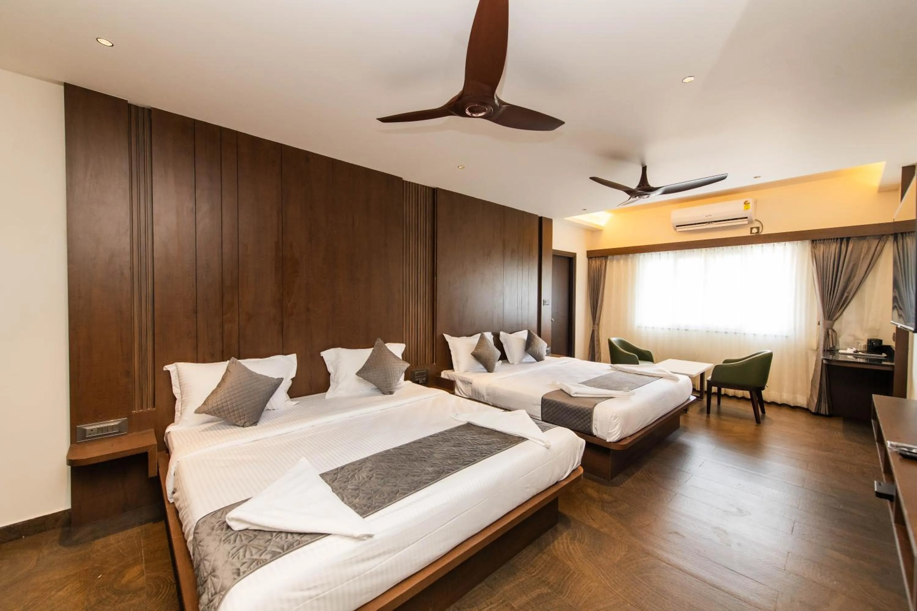 Bed in Hotel Mysore Radiance