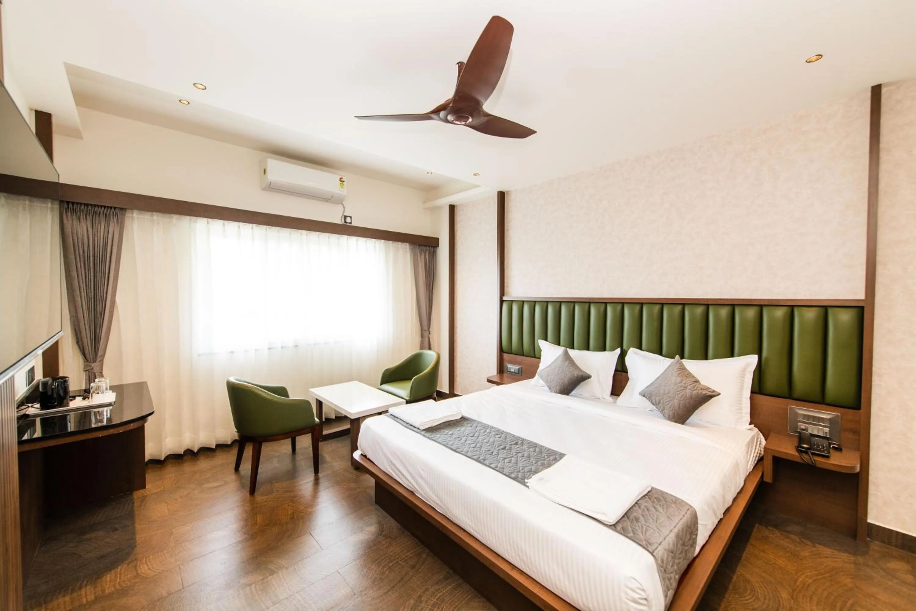 Bed in Hotel Mysore Radiance