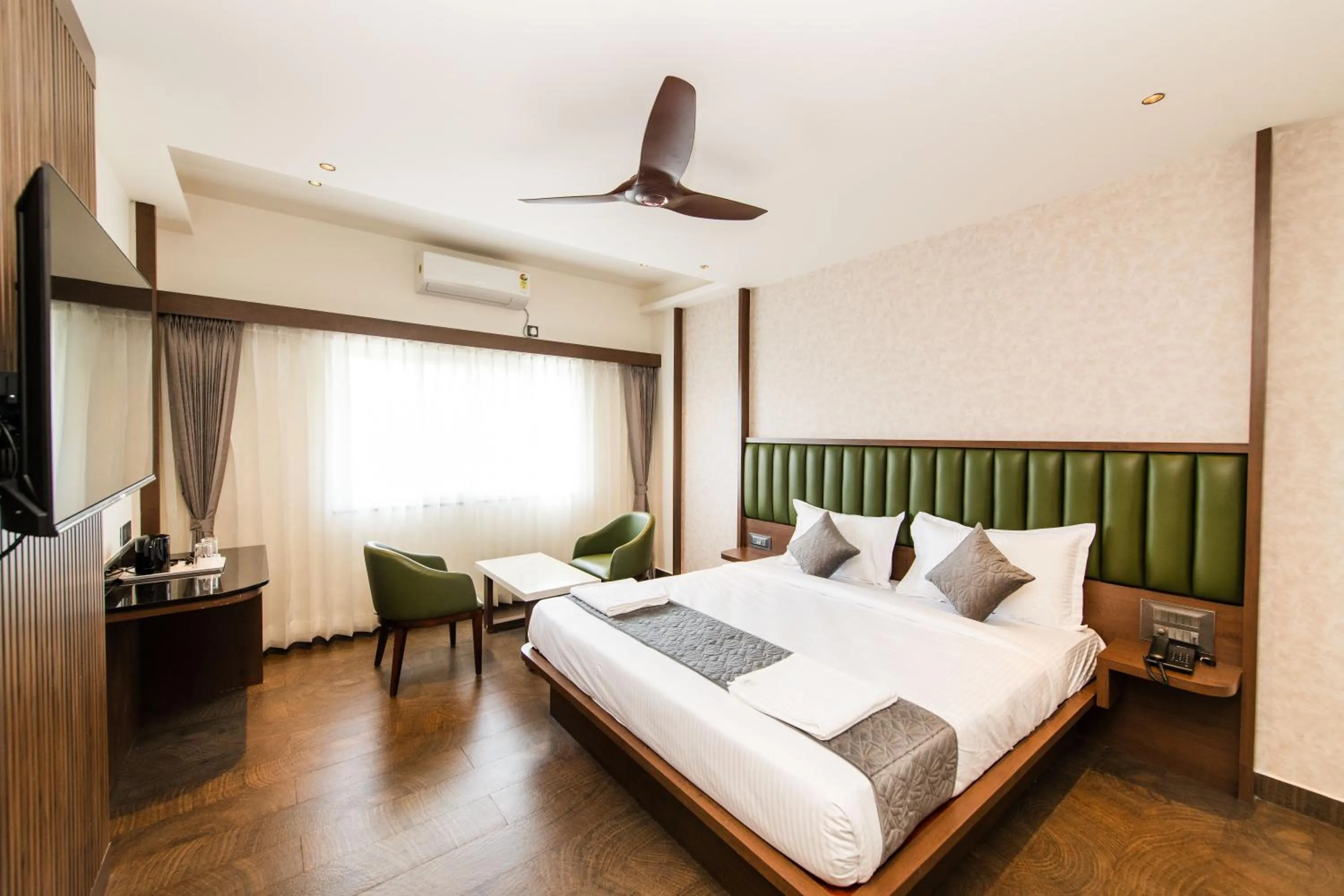Bed in Hotel Mysore Radiance