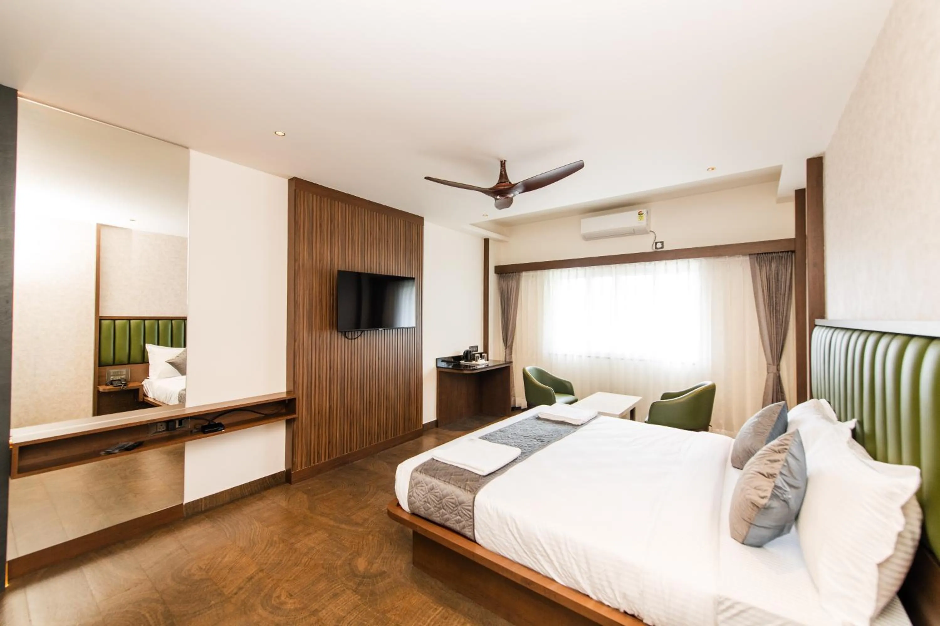 Bed in Hotel Mysore Radiance