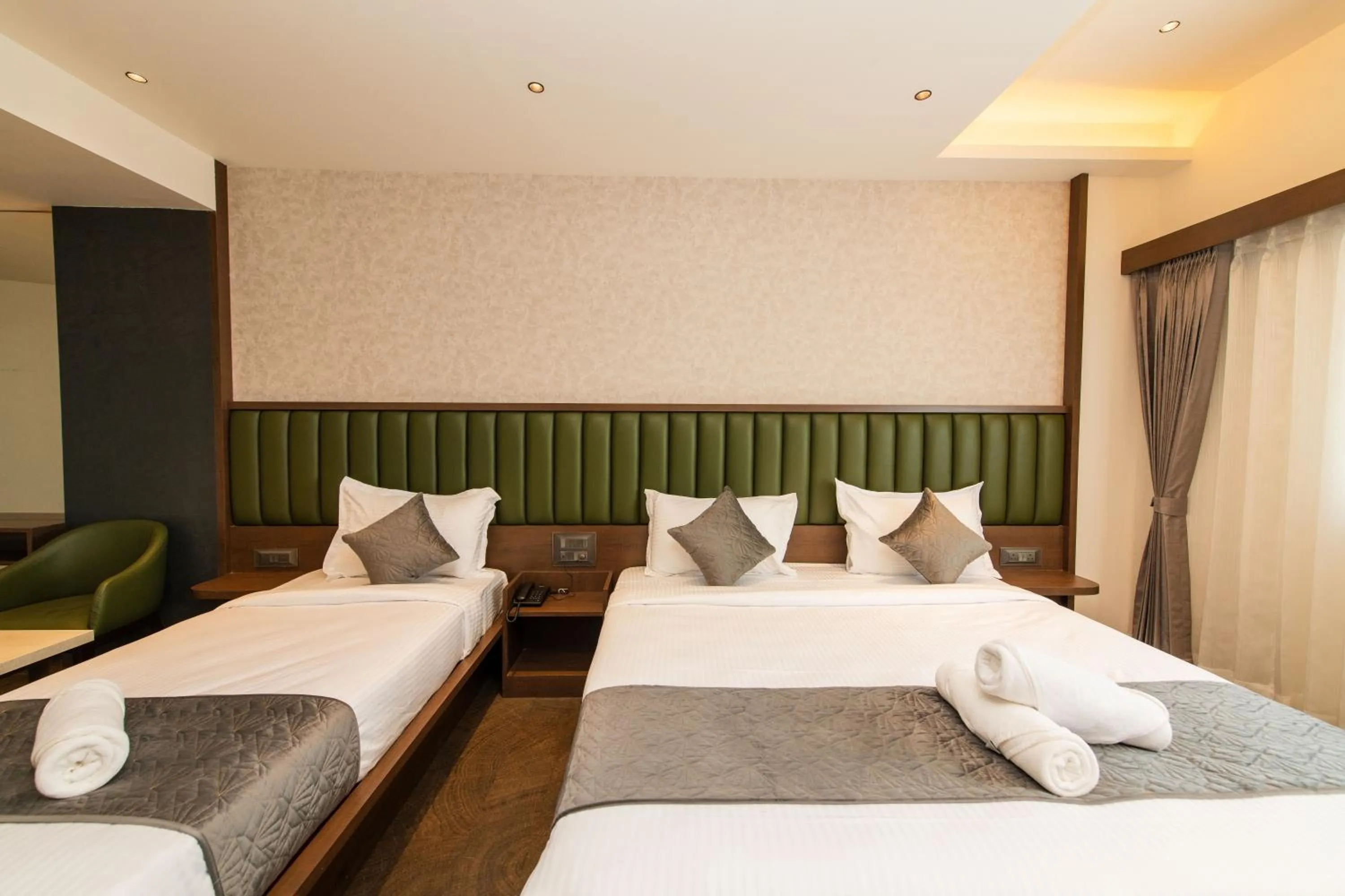 Bed in Hotel Mysore Radiance