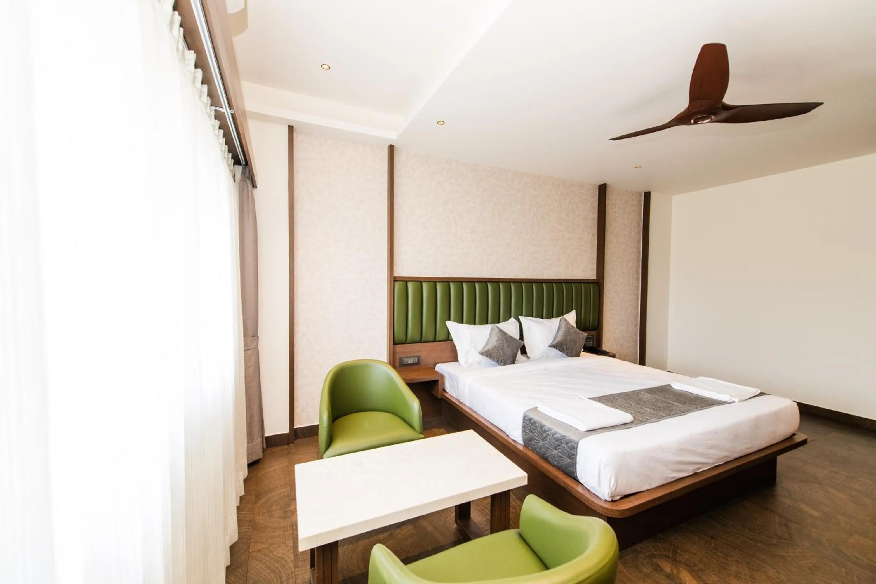 Bed in Hotel Mysore Radiance