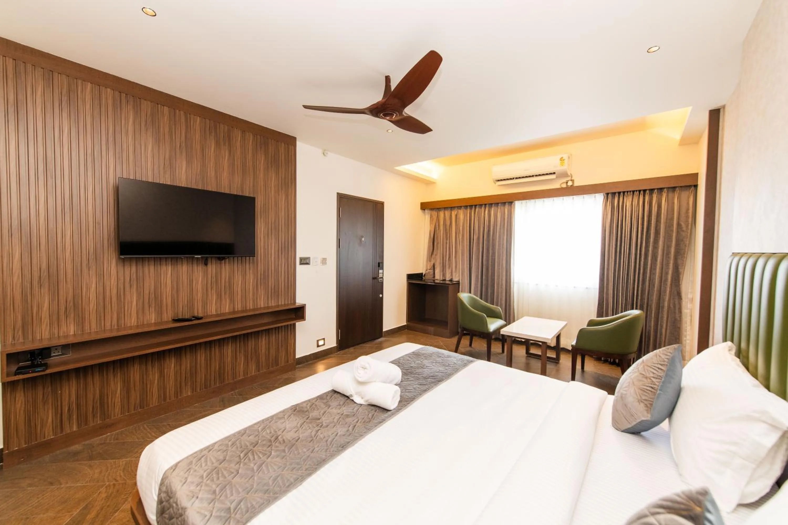 Bed in Hotel Mysore Radiance