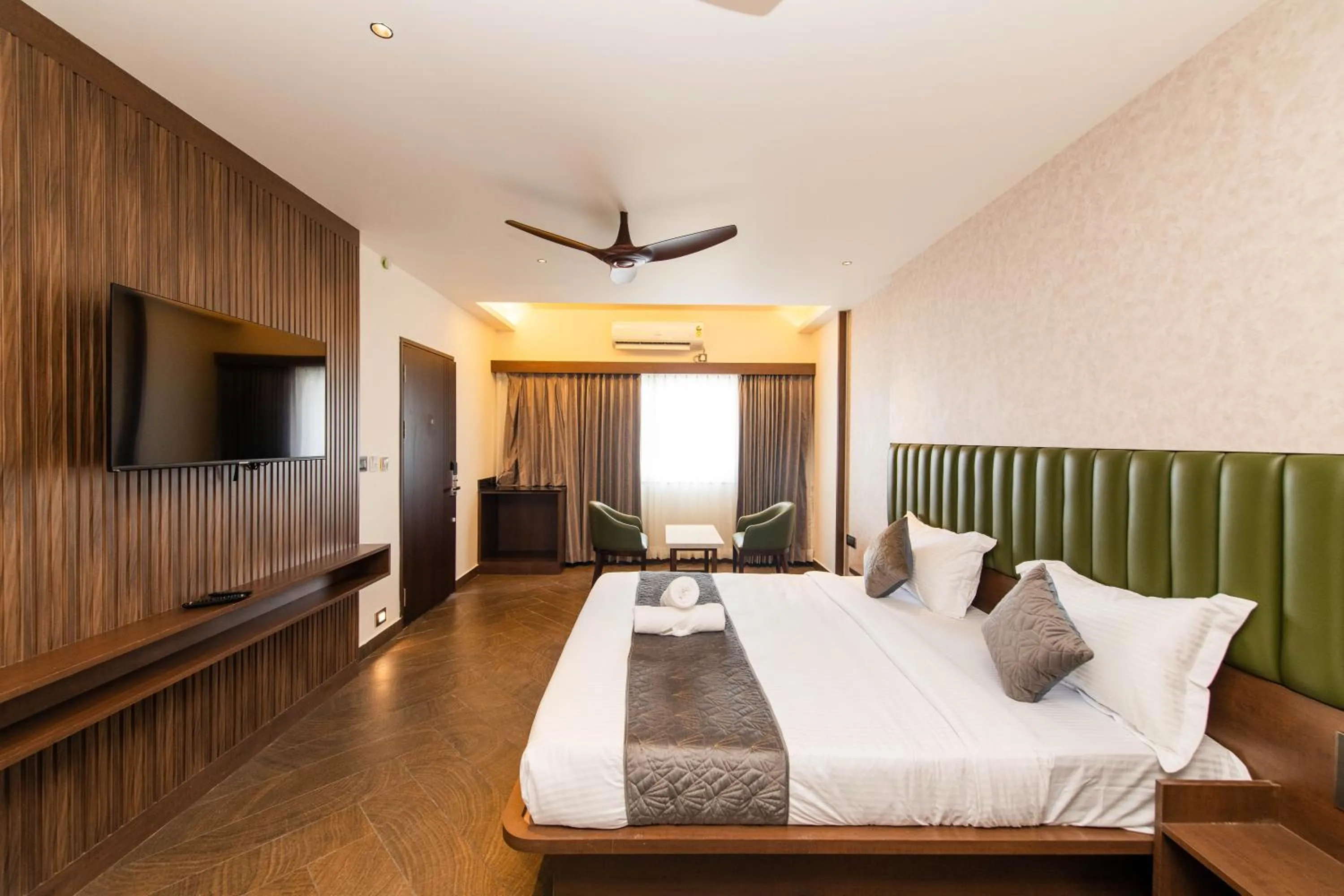 Bed in Hotel Mysore Radiance