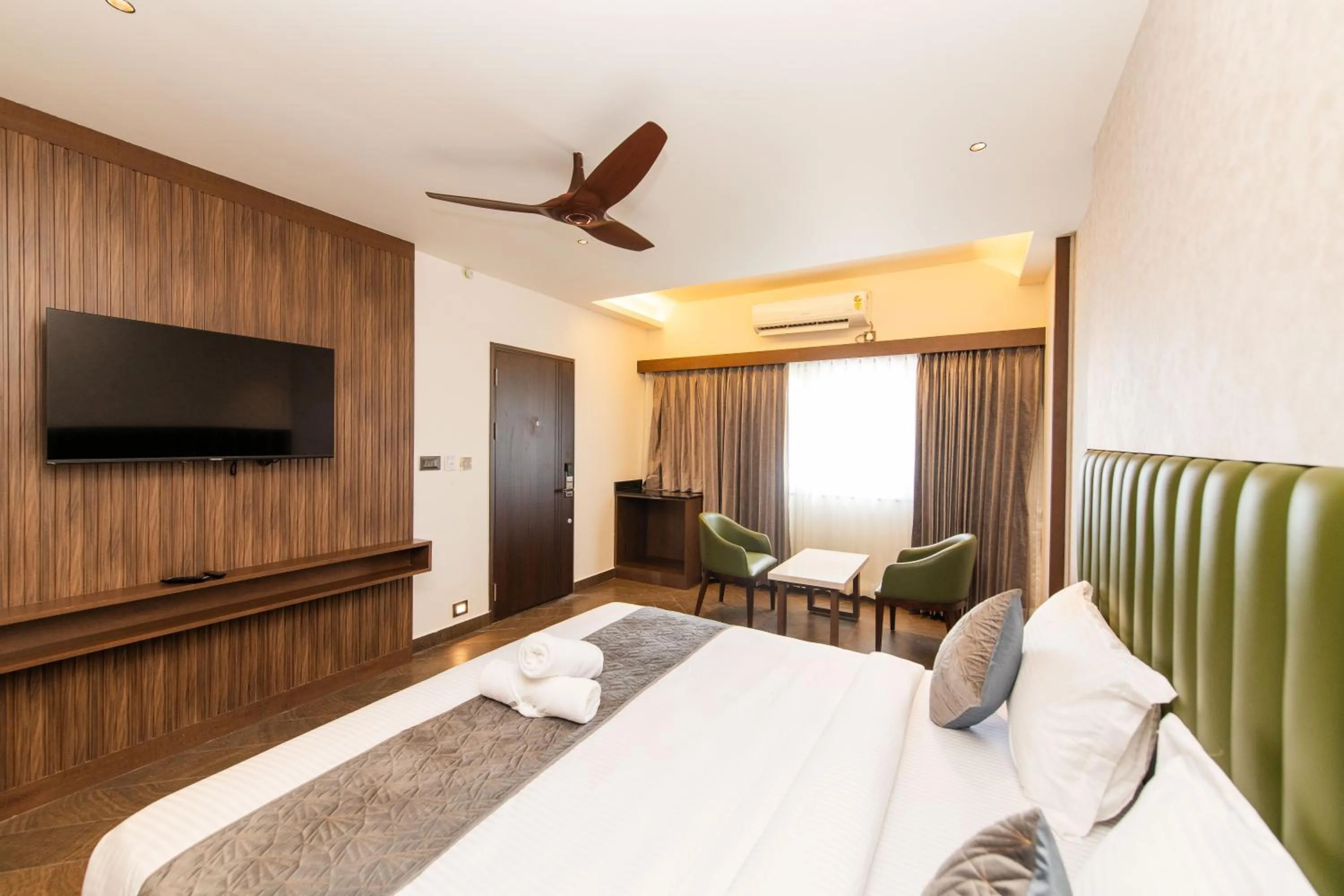 Bed in Hotel Mysore Radiance