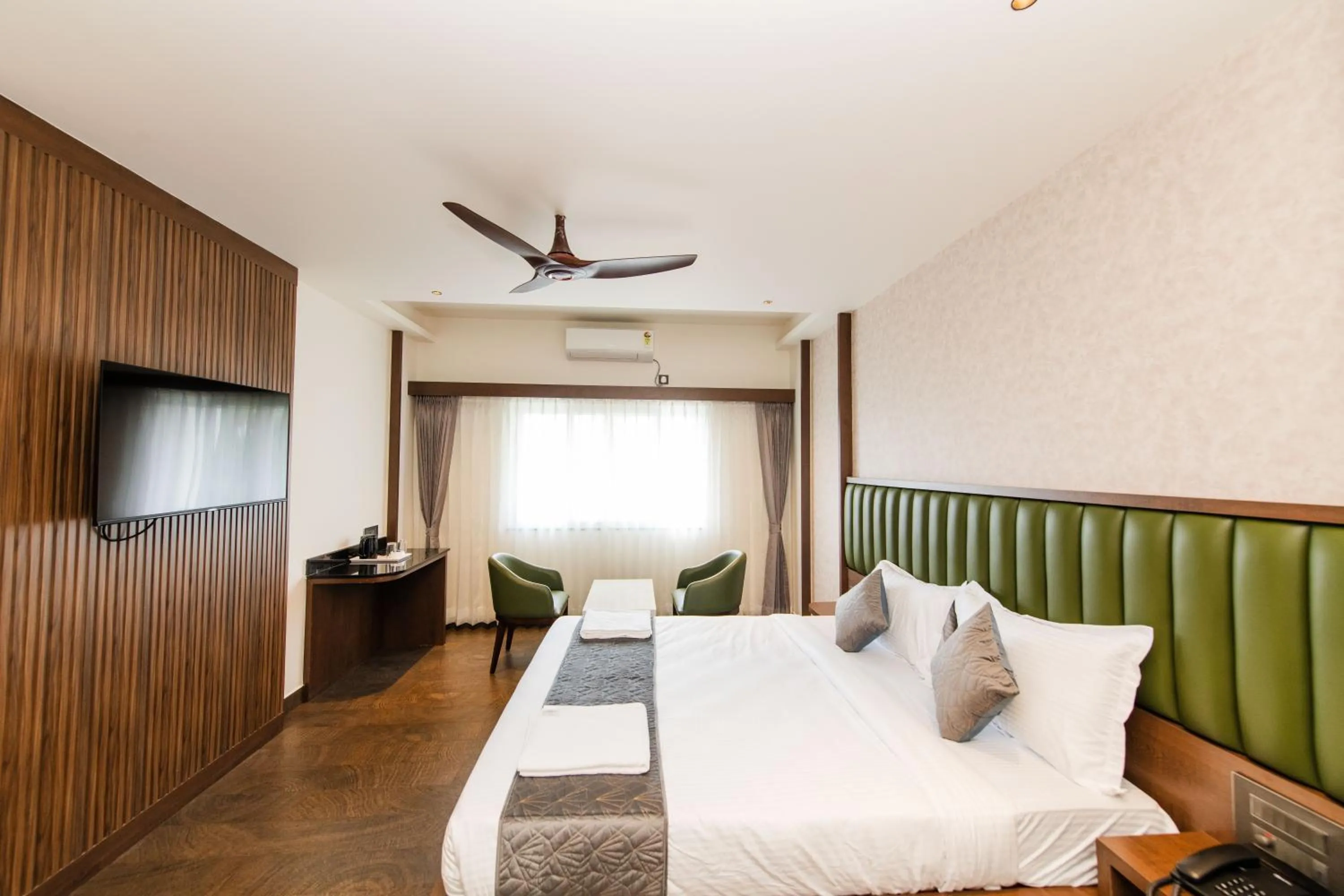 Bed in Hotel Mysore Radiance