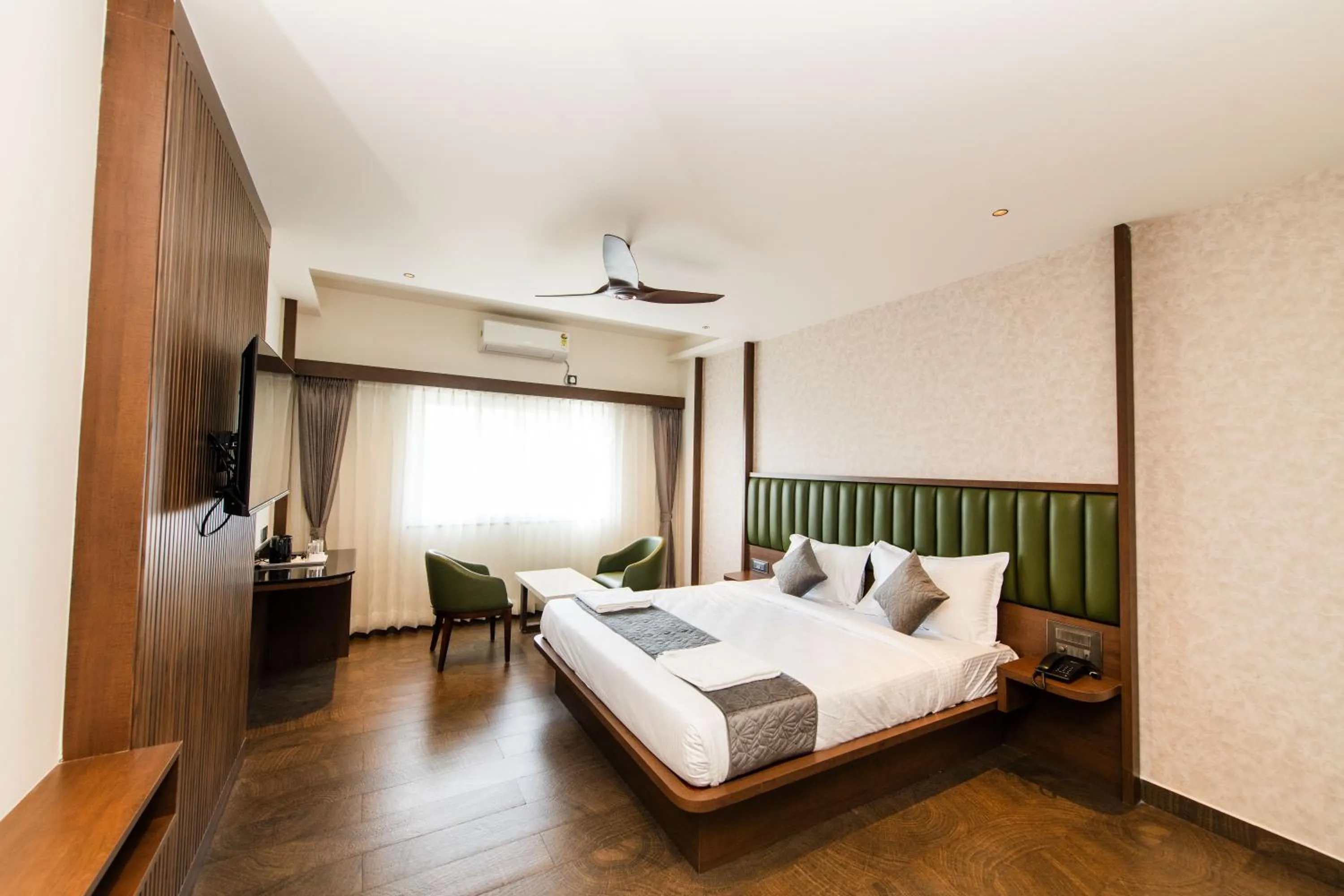 Bed in Hotel Mysore Radiance