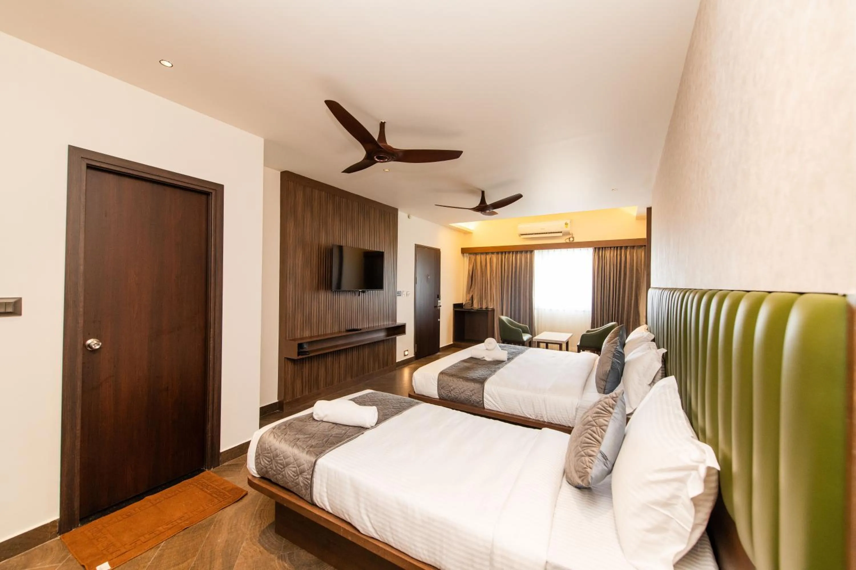 Bed in Hotel Mysore Radiance