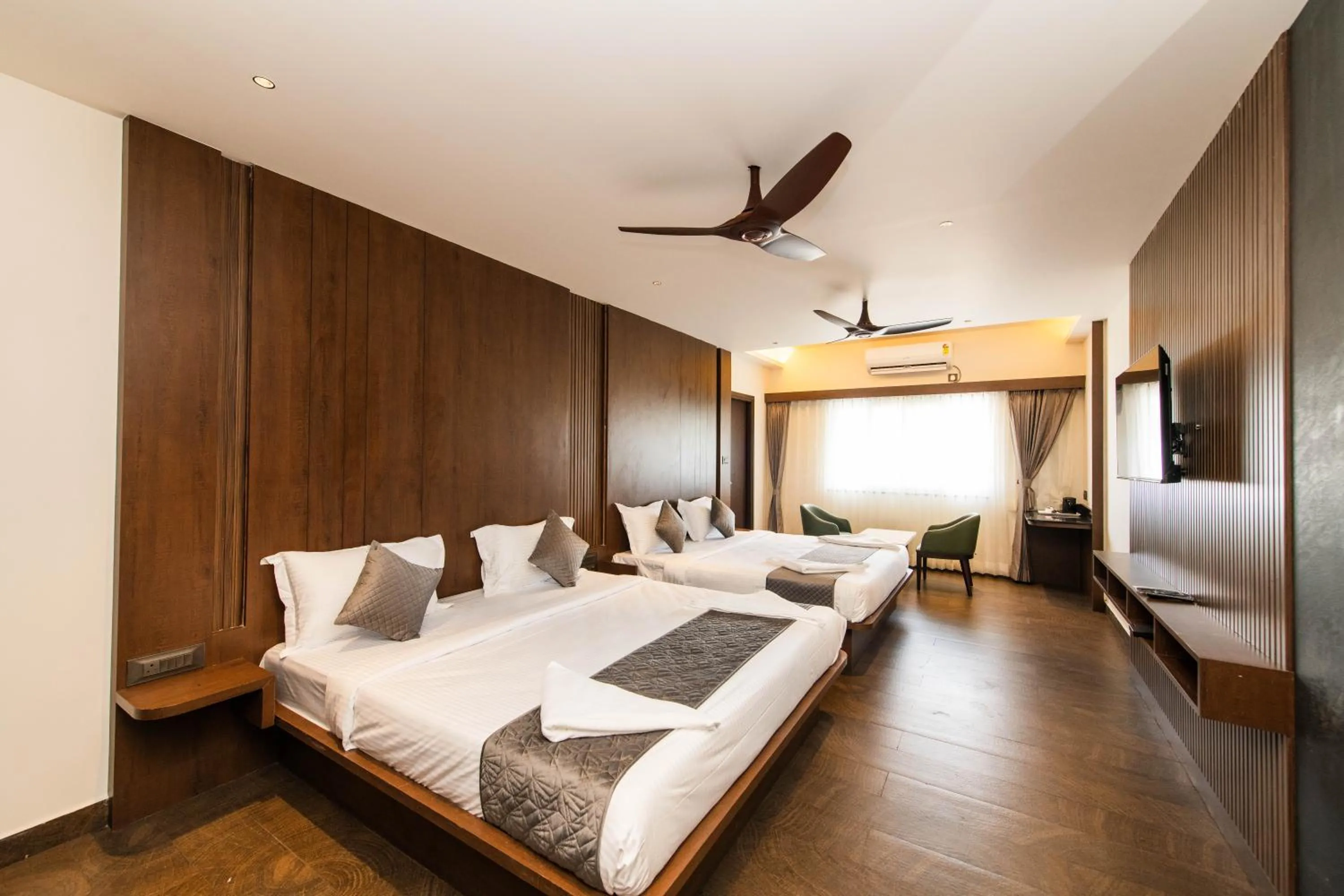 Bed in Hotel Mysore Radiance