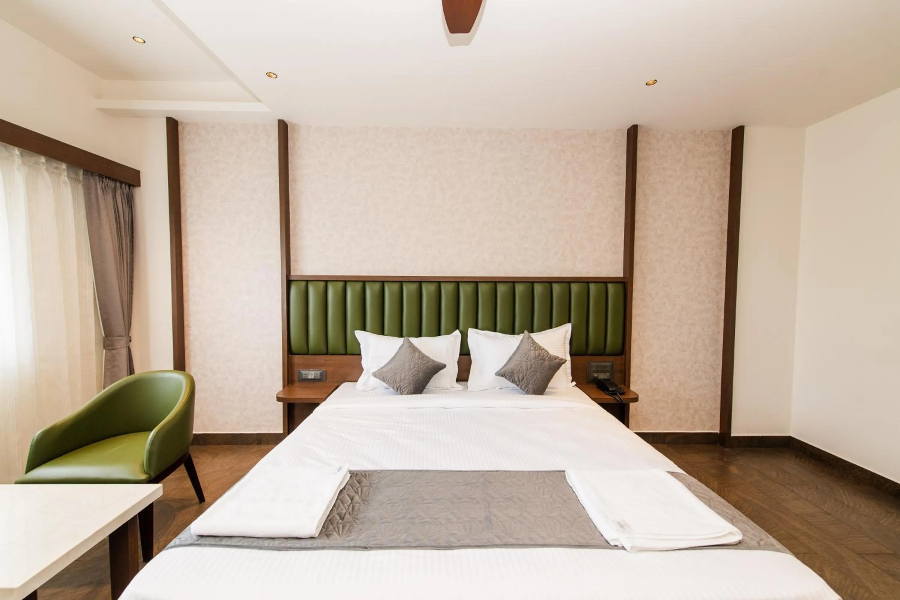 Bed in Hotel Mysore Radiance