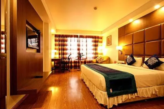 Bed in The Atrium Boutique Hotel