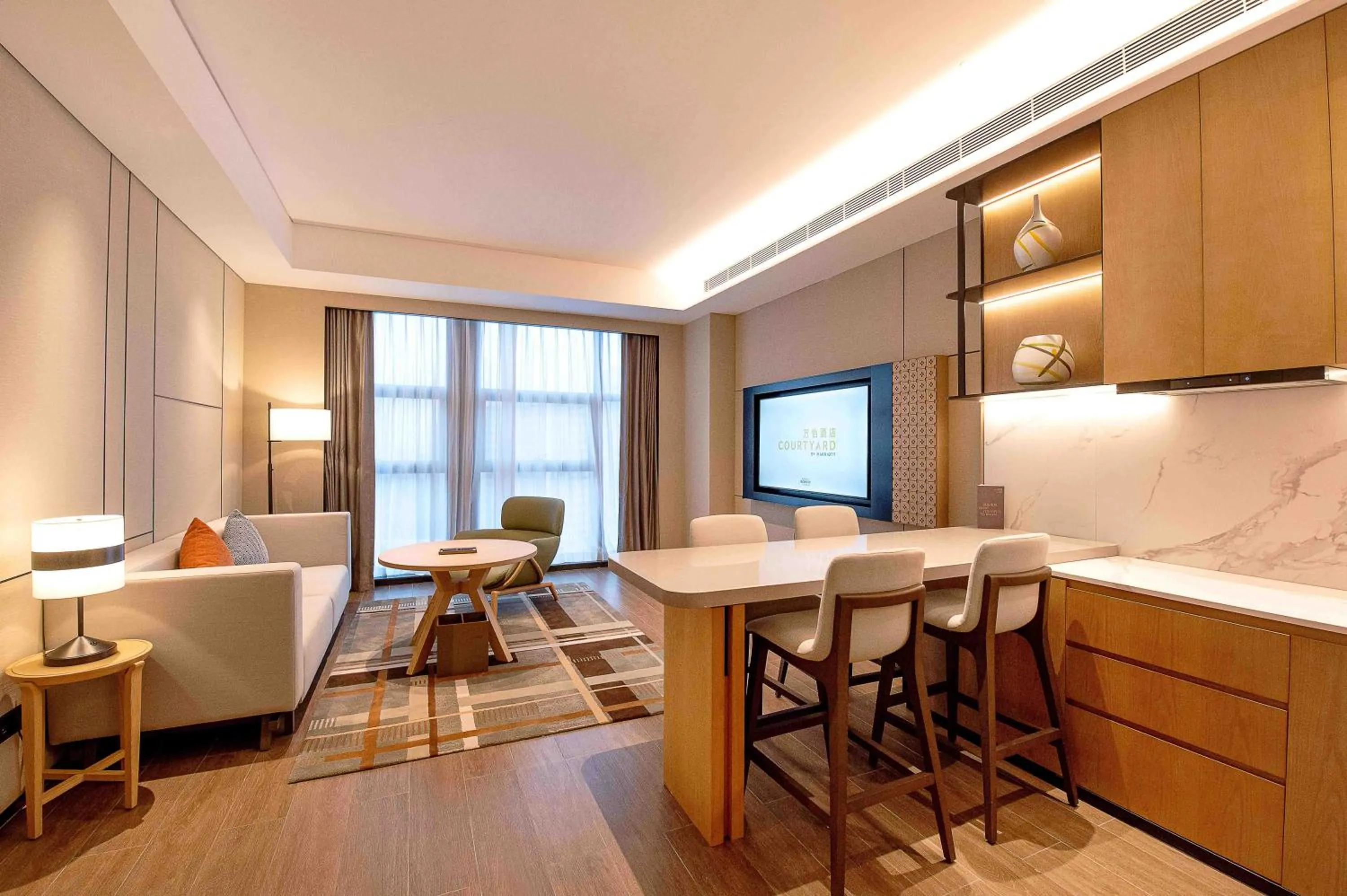 Living room in Courtyard by Marriott Nanning Wuxiang