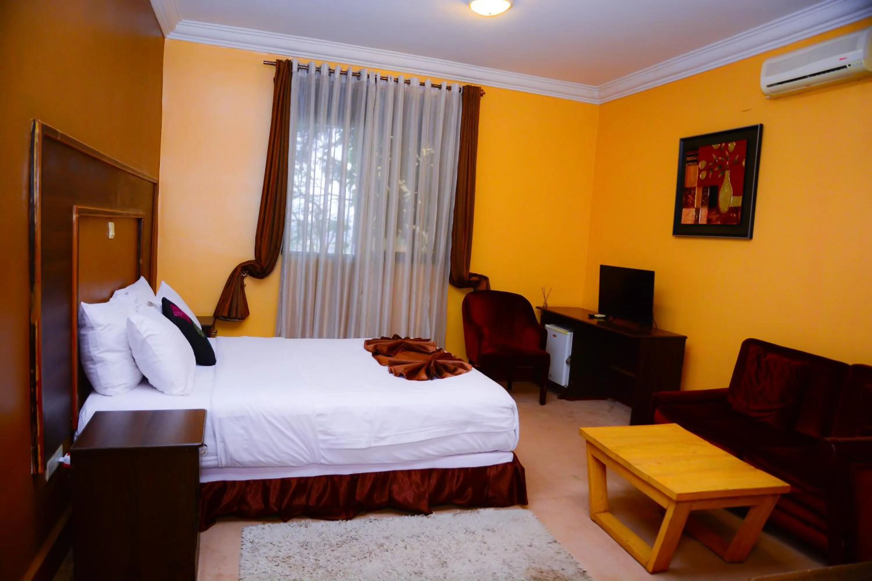 Bed in The Country Inn Hotel