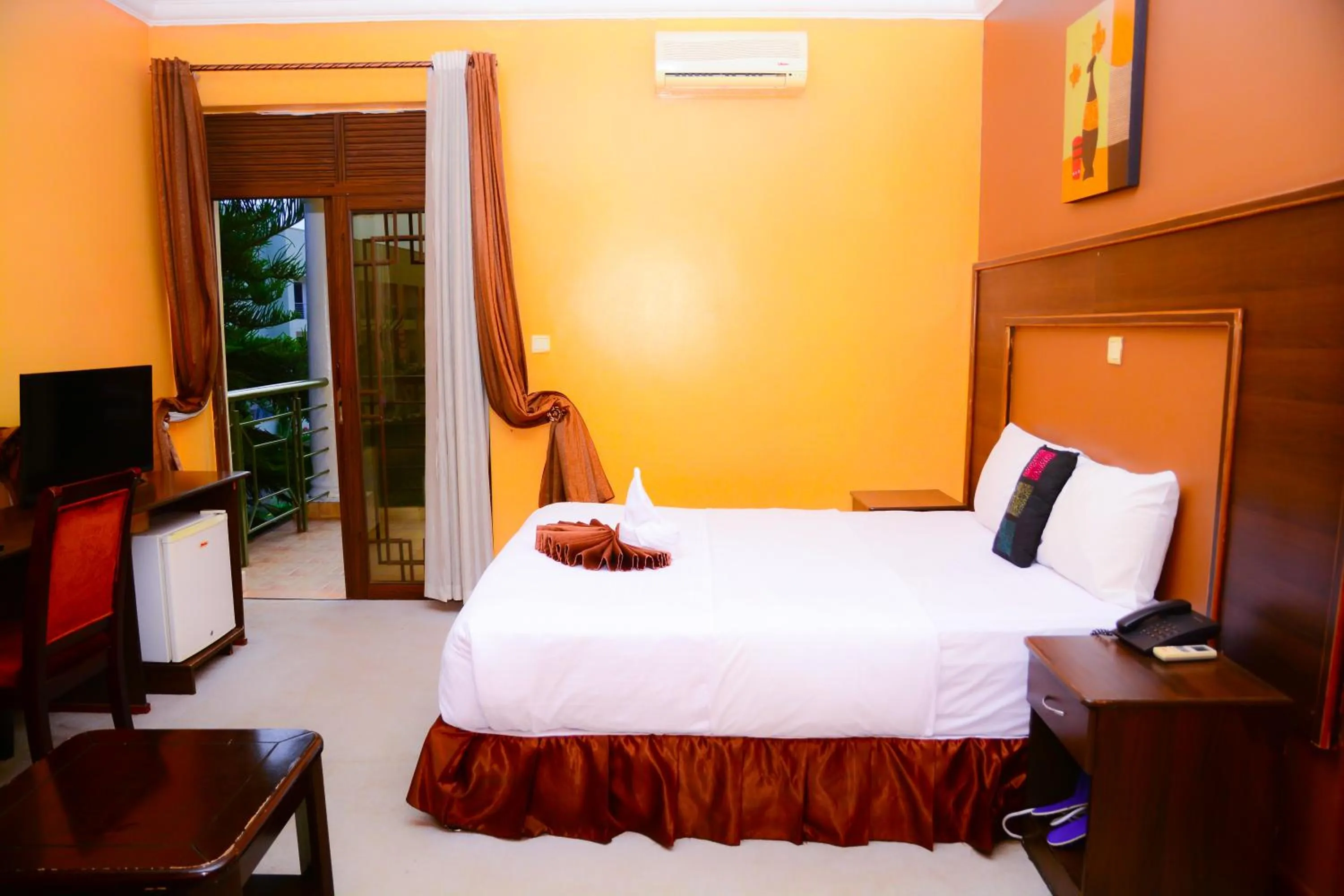 Bed in The Country Inn Hotel