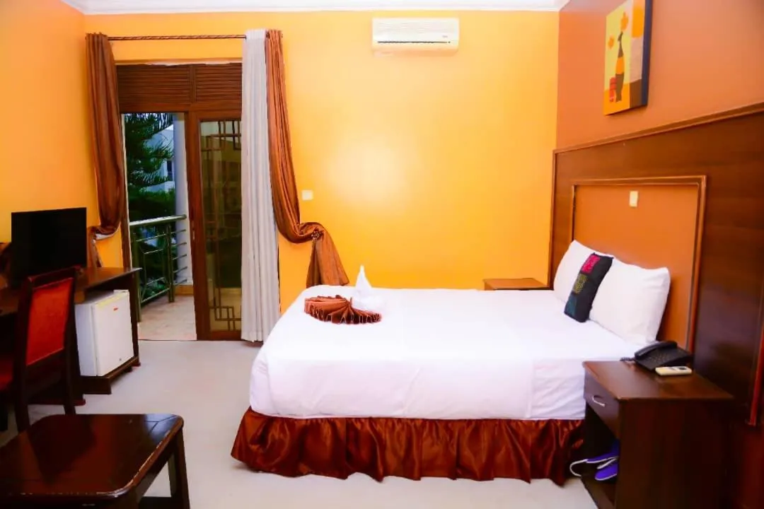 Bed in The Country Inn Hotel