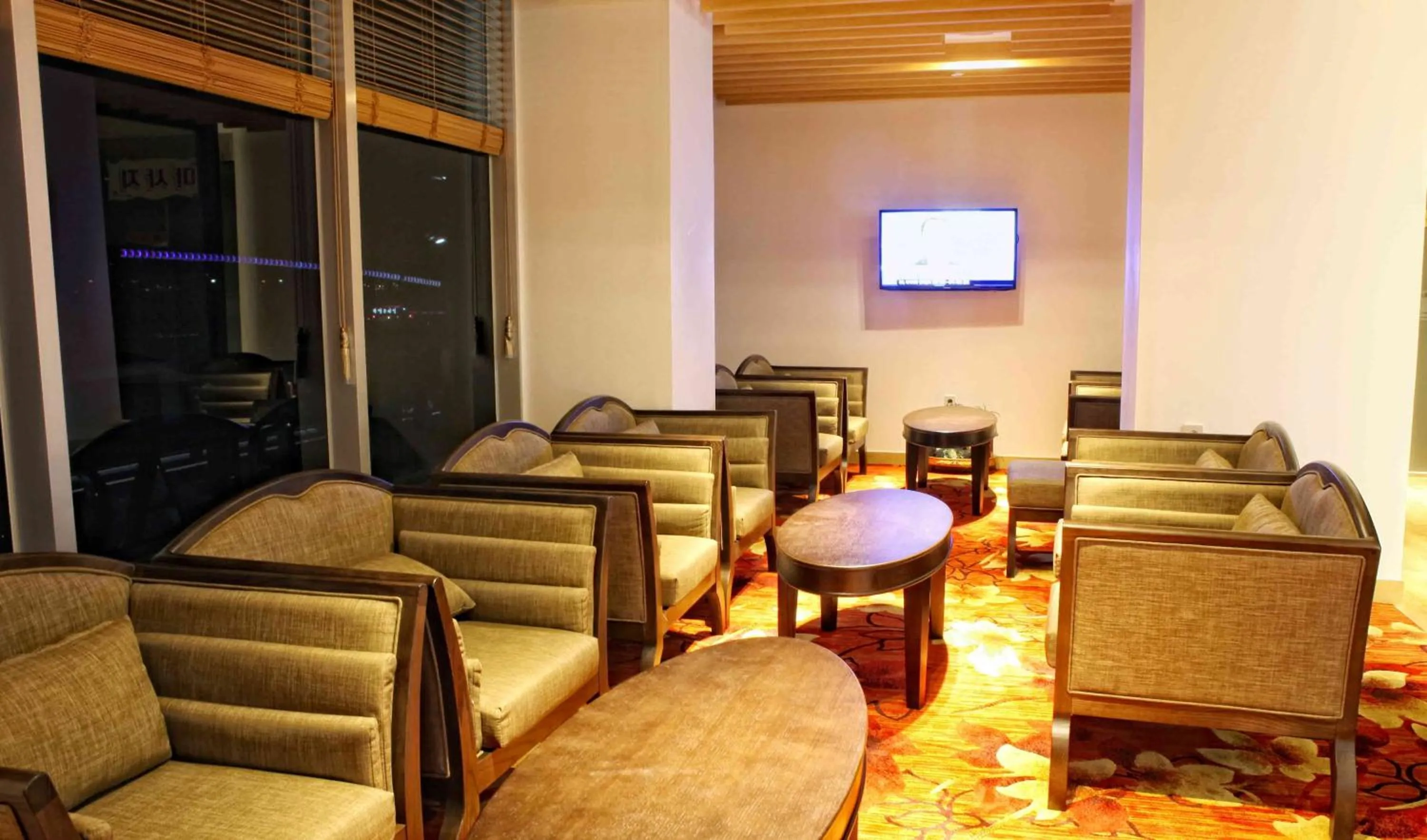 Communal lounge/ TV room in Fontana Beach Hotel