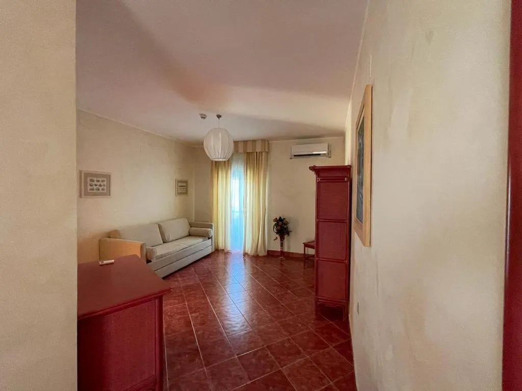 Seating area, Bed in AH Premium Baia dei Faraglioni