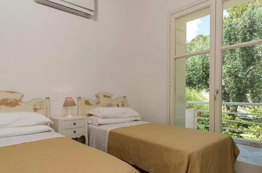 Bed in AH Premium Baia dei Faraglioni