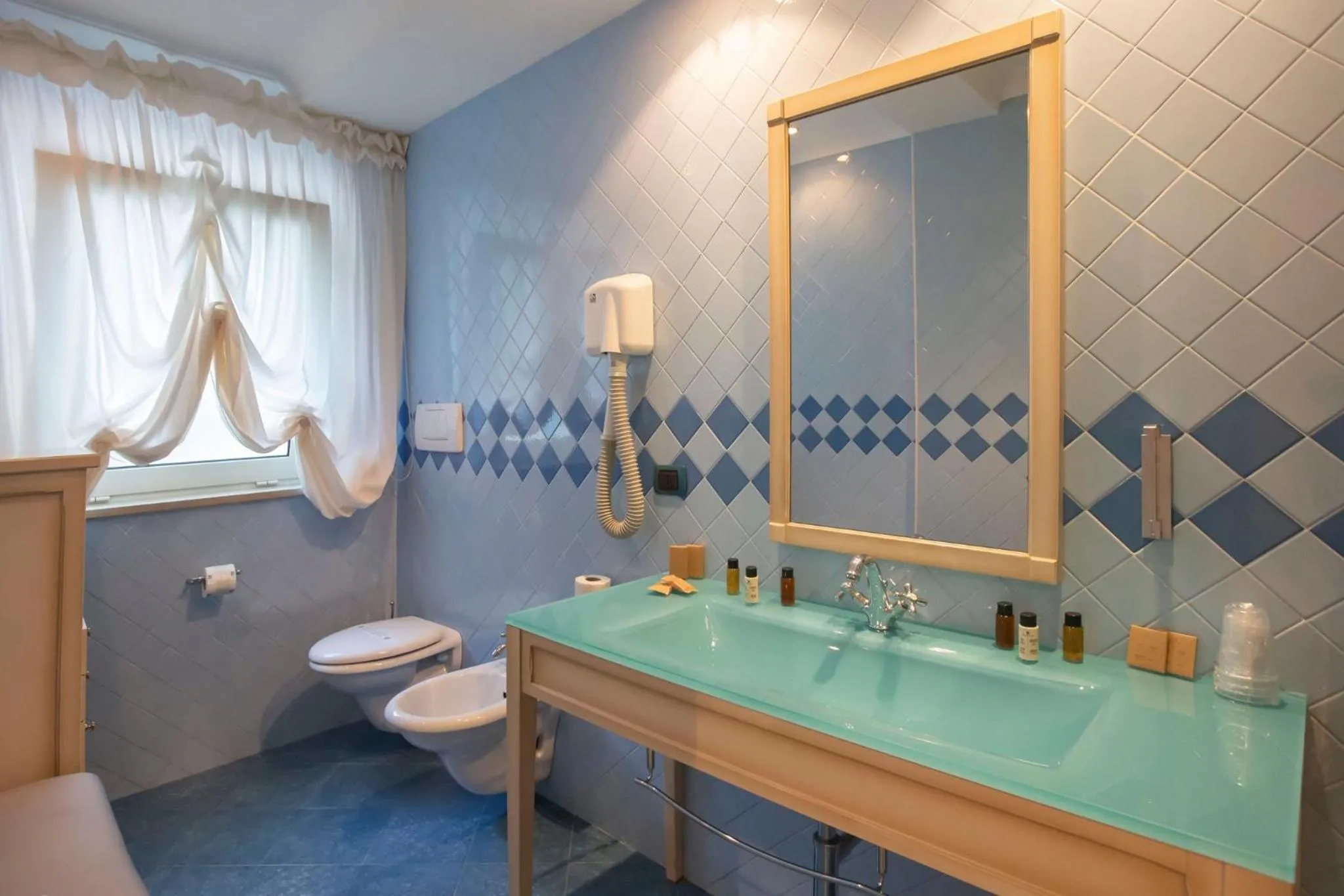 Bathroom in AH Premium Baia dei Faraglioni