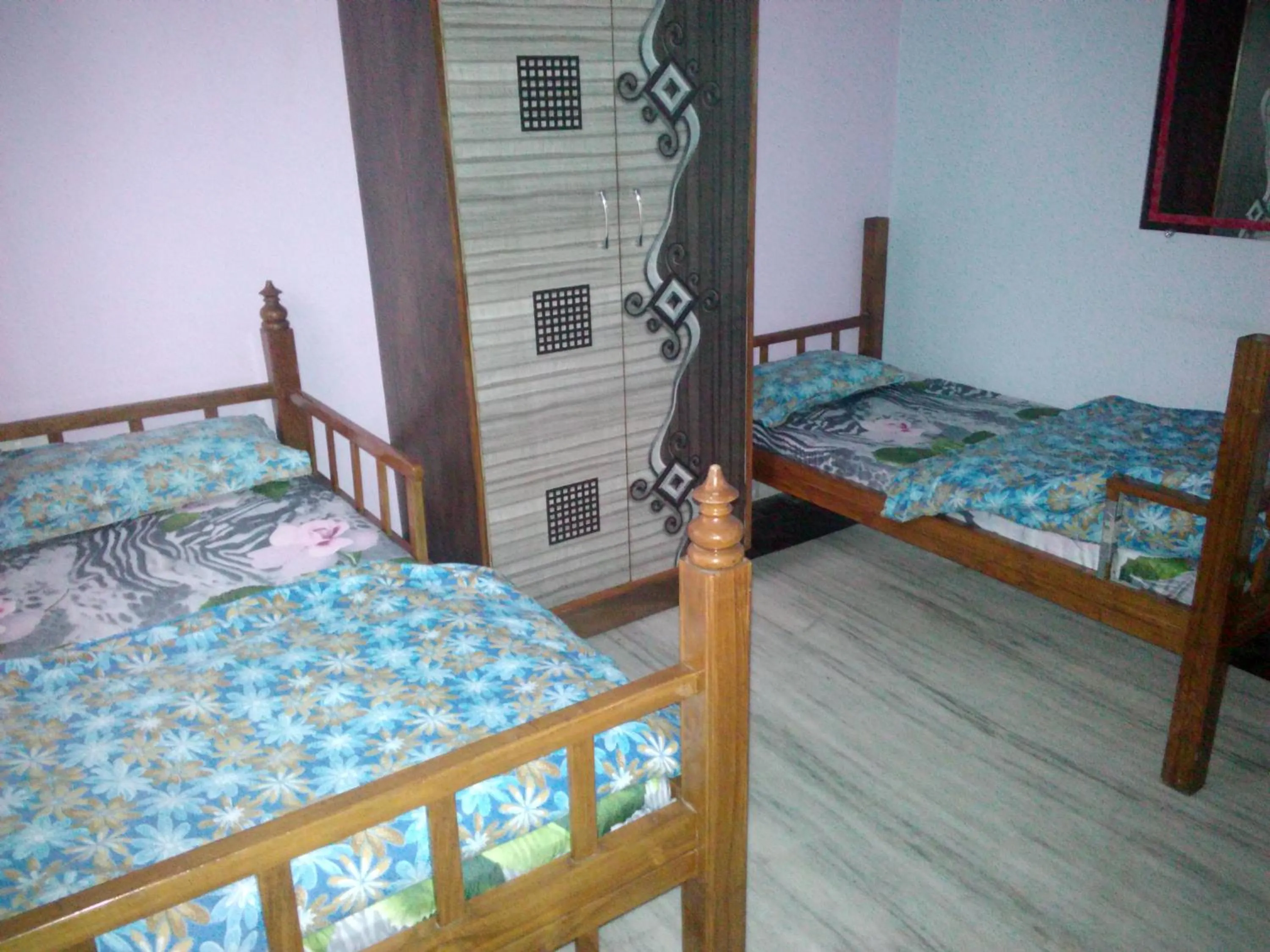 Photo of the whole room in Hotel Golden Crown Laxman Jhula