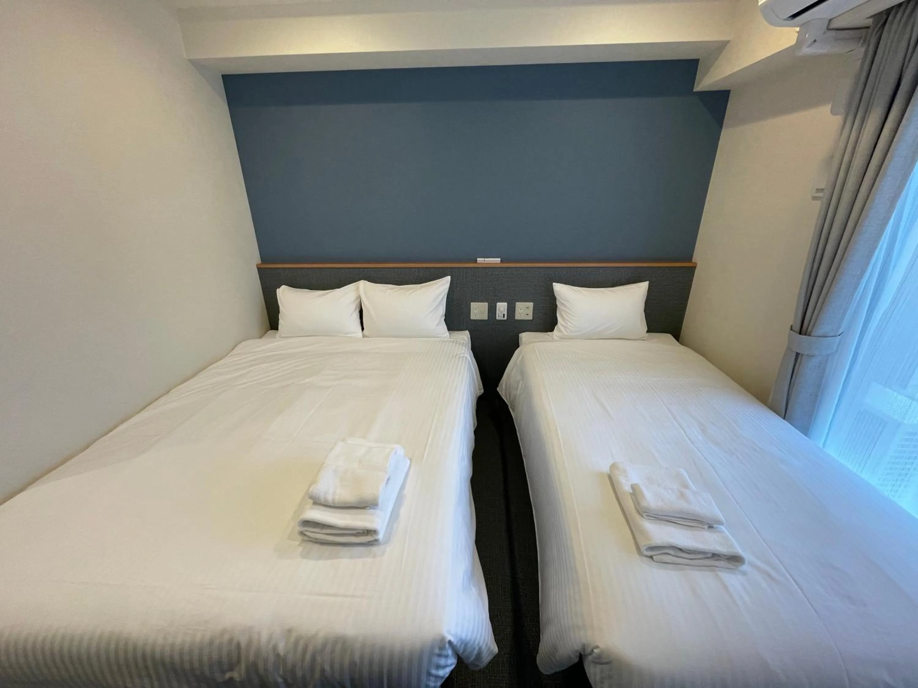 Bed in Hotel Living Inn Kenchoumaeeki