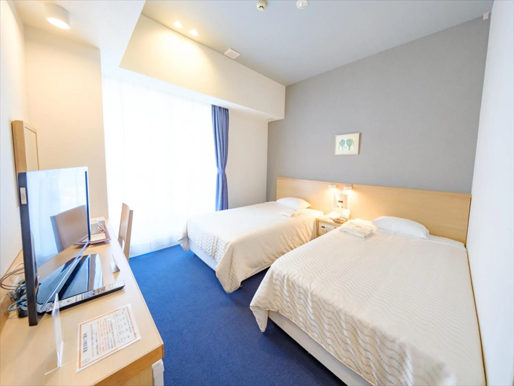 Photo of the whole room, Bed in Hotel Risingsun Miyakojima
