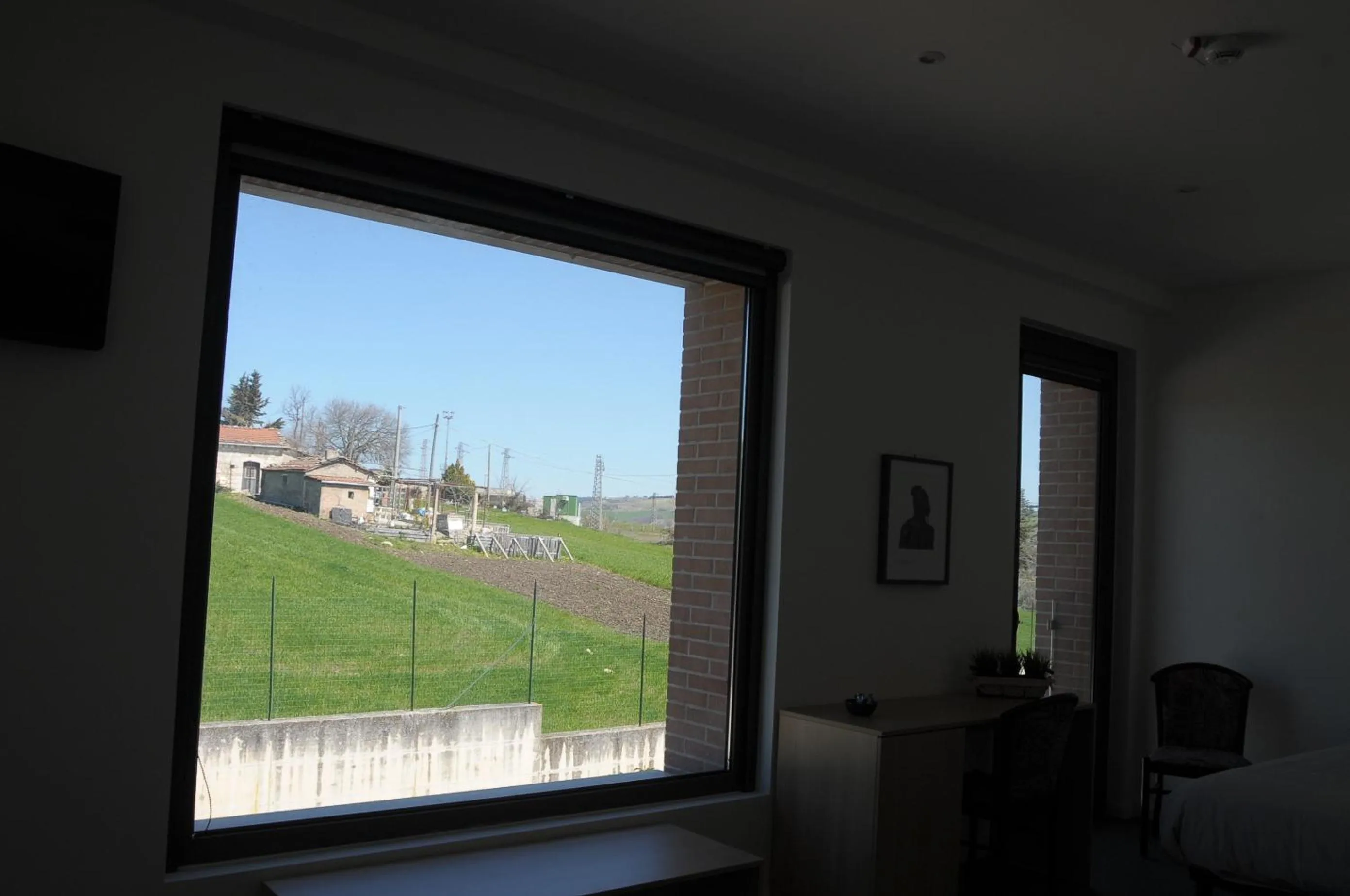 Bedroom in Hotel La Tavernetta