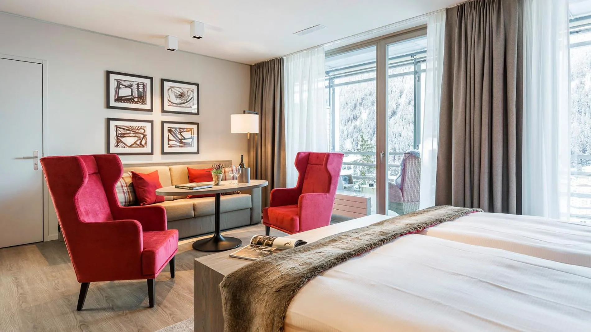 Seating area, Bed in AMERON Davos Swiss Mountain Resort