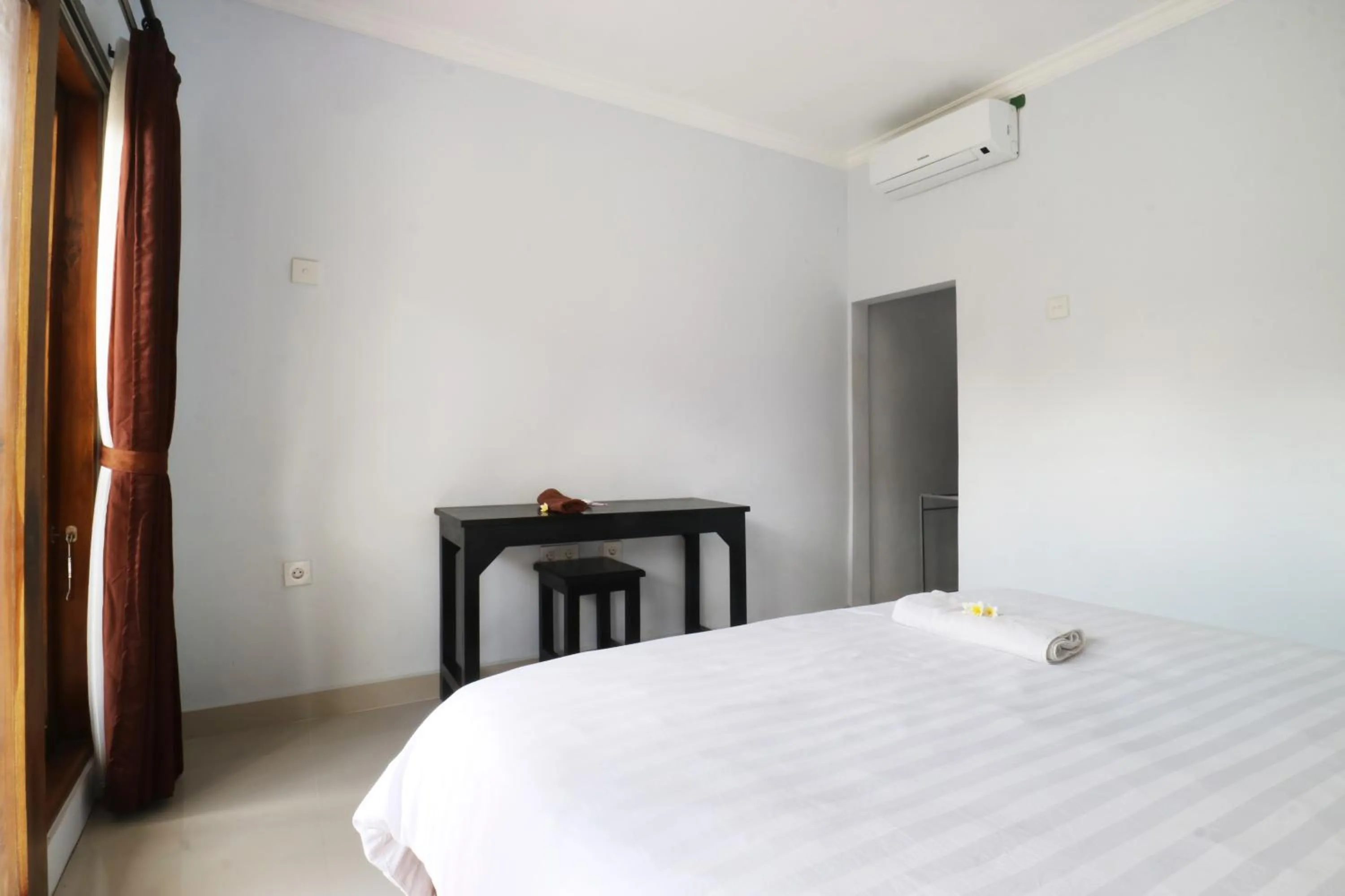 Bed in The Wina Echo Beach Guest House