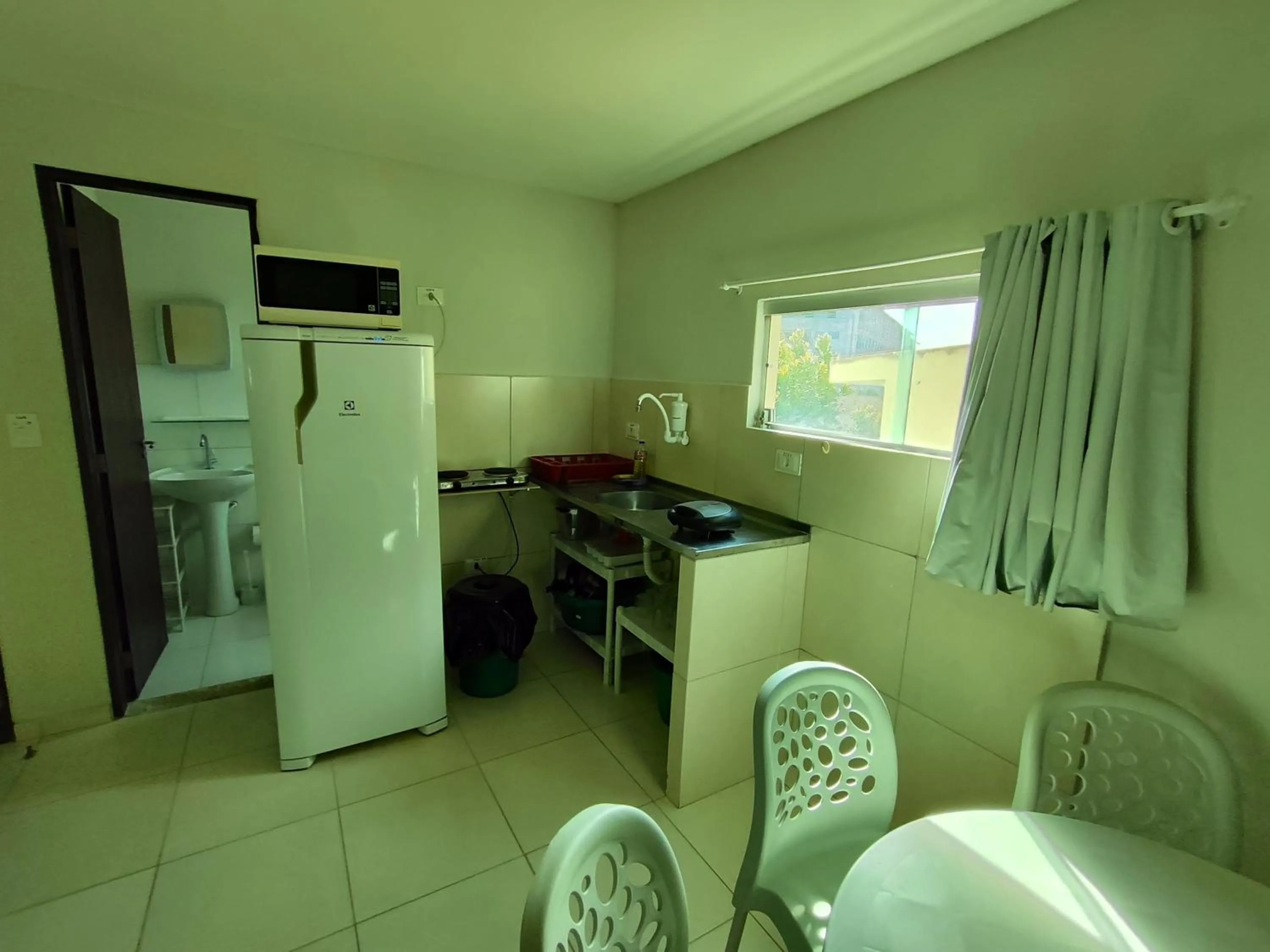 Kitchen or kitchenette in Divinos Flat Carneiros
