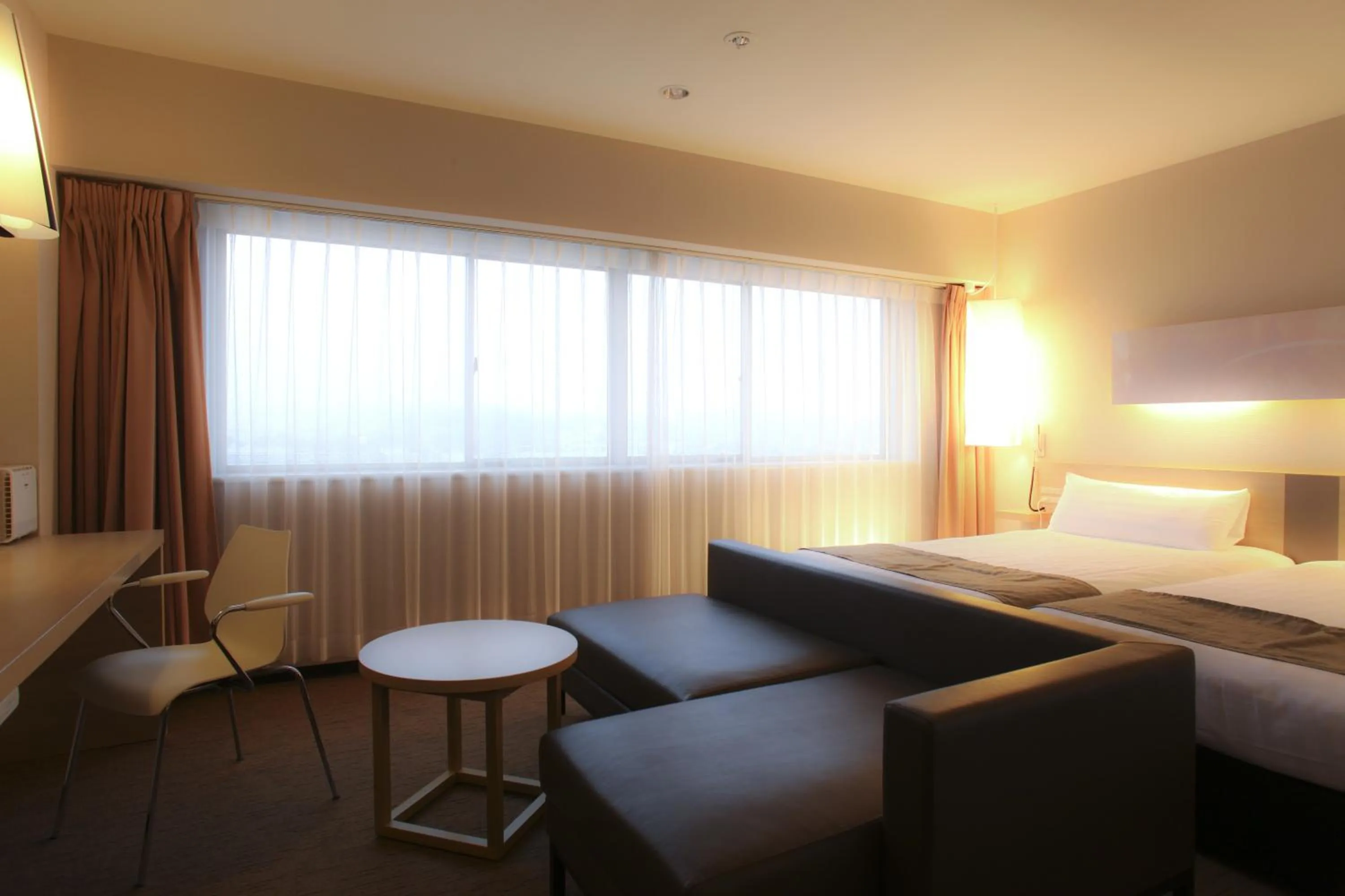 Seating area, Bed in Hotel Inside Numazu Inter