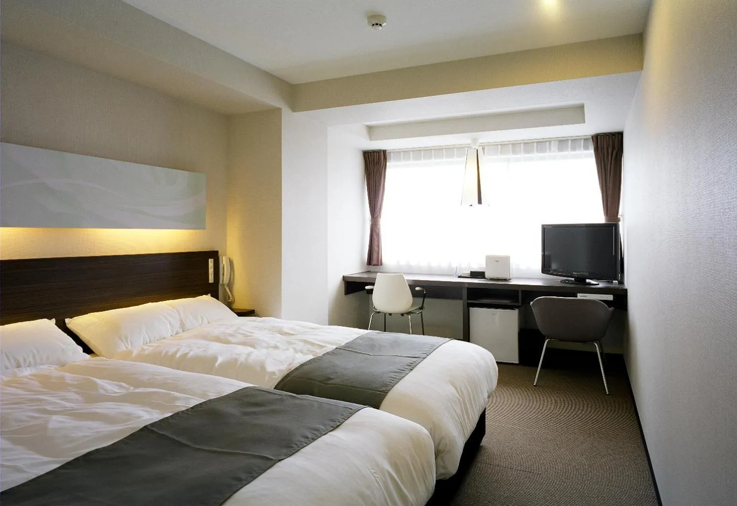 Bed in Hotel Inside Numazu Inter