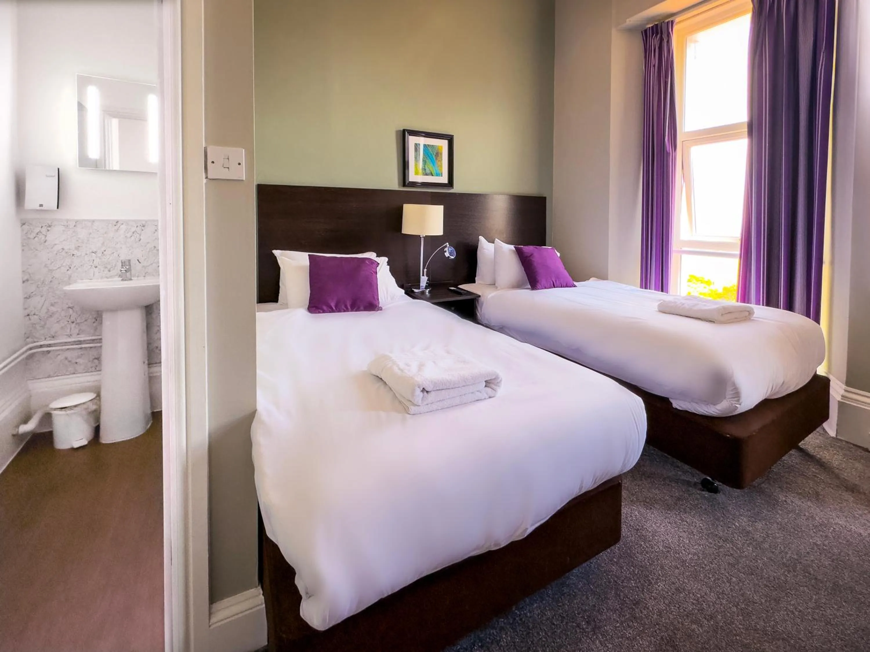 Bed in The Esplanade Hotel by Compass Hospitality