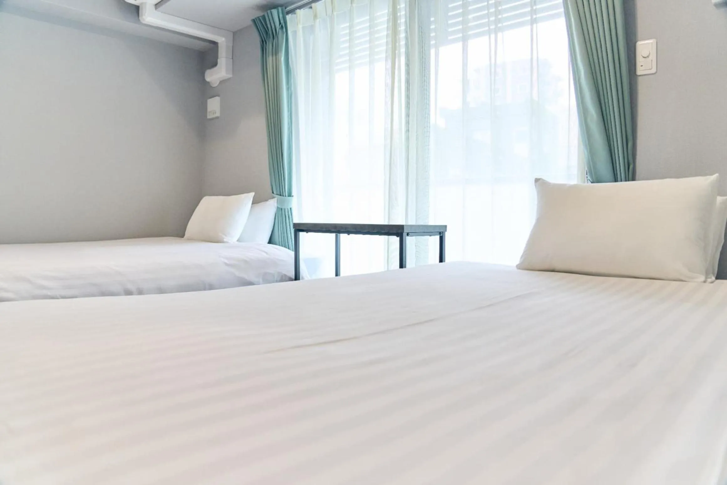 Bed in Vacation Rental Hotel TENMONKAN