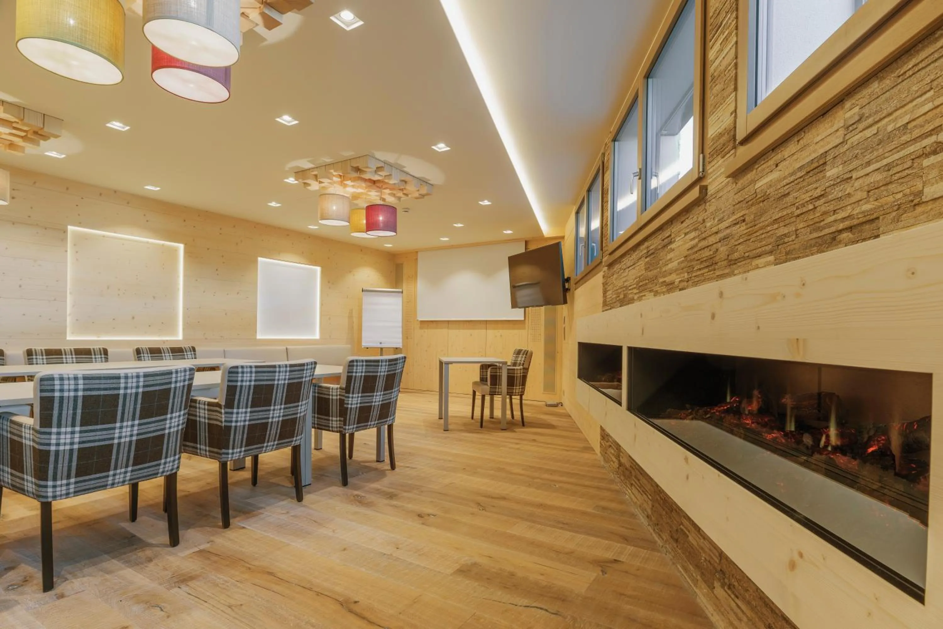 Communal lounge/ TV room in Caschu Alp Boutique Design Hotel Stoos - adults only