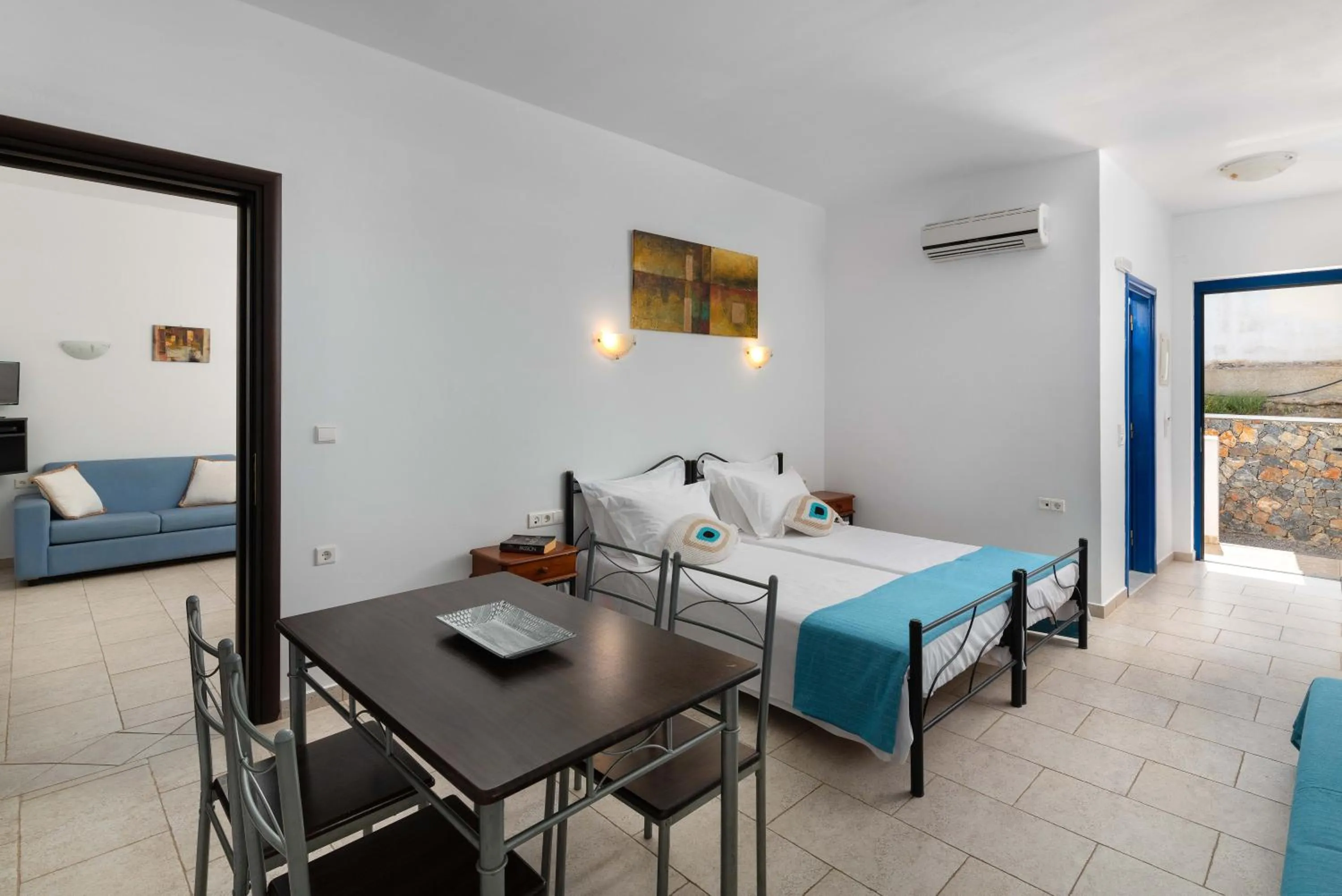 Seating area, Bed in 'Lindian Myth' Sea View Studios